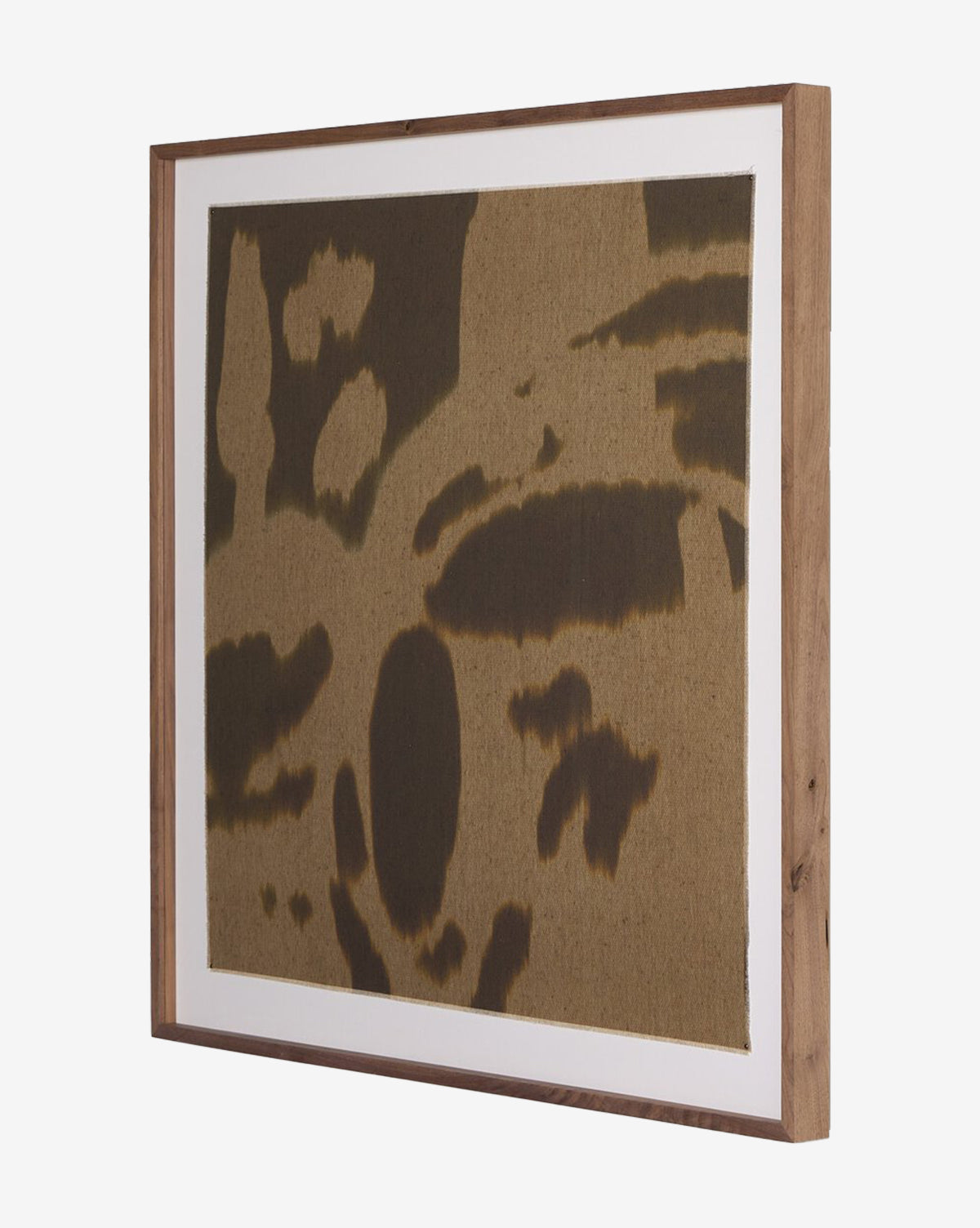 Enigmatic 2 by Shatha Al Dafai is a framed abstract artwork featuring irregular dark brown shapes on textured raw canvas, set in a simple wooden frame with crisp white matting, by Vendixs