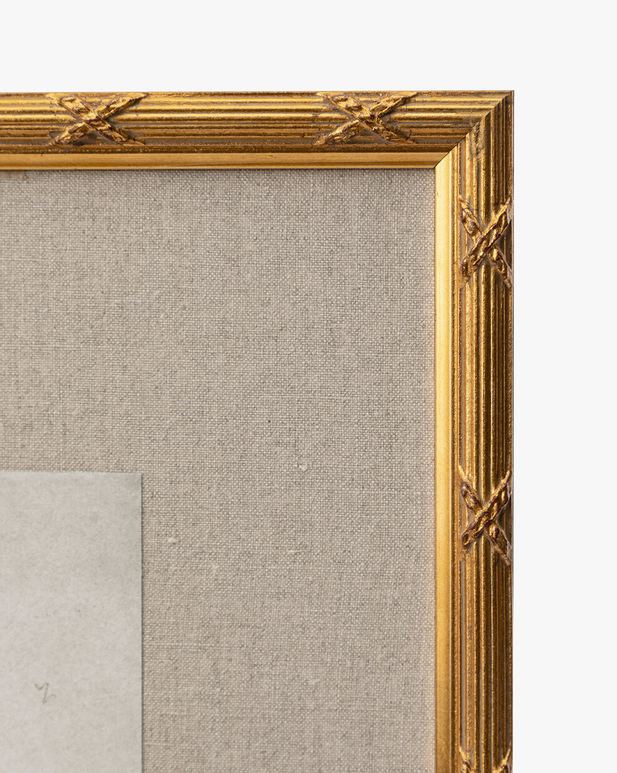 Close-up of the top right corner of the gold leaf frame with a textured beige fabric backing, showcasing part of the gray rectangular Feathery Floral giclée on paper within the frame by Vendixs