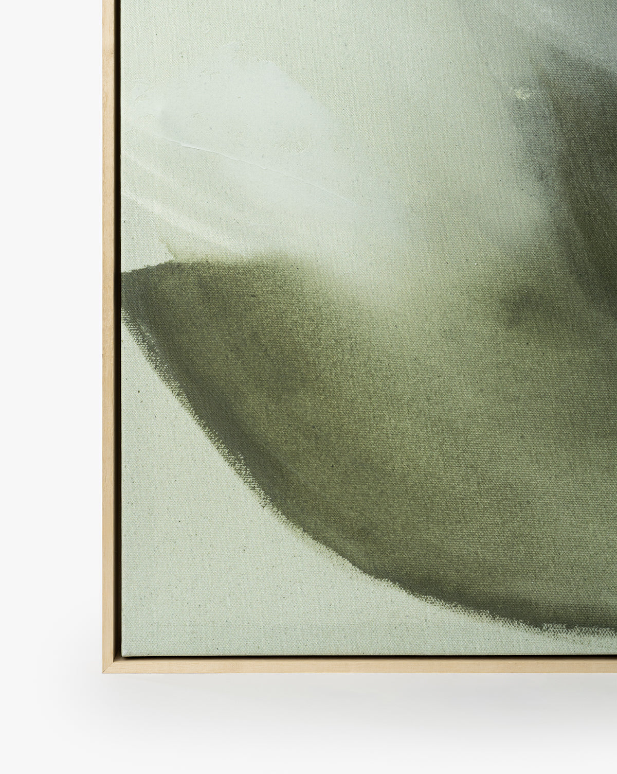 Close-up of Fields of Green, a minimalist abstract art giclee print featuring soft green and gray hues, framed in light wood against a white background, by Vendixs