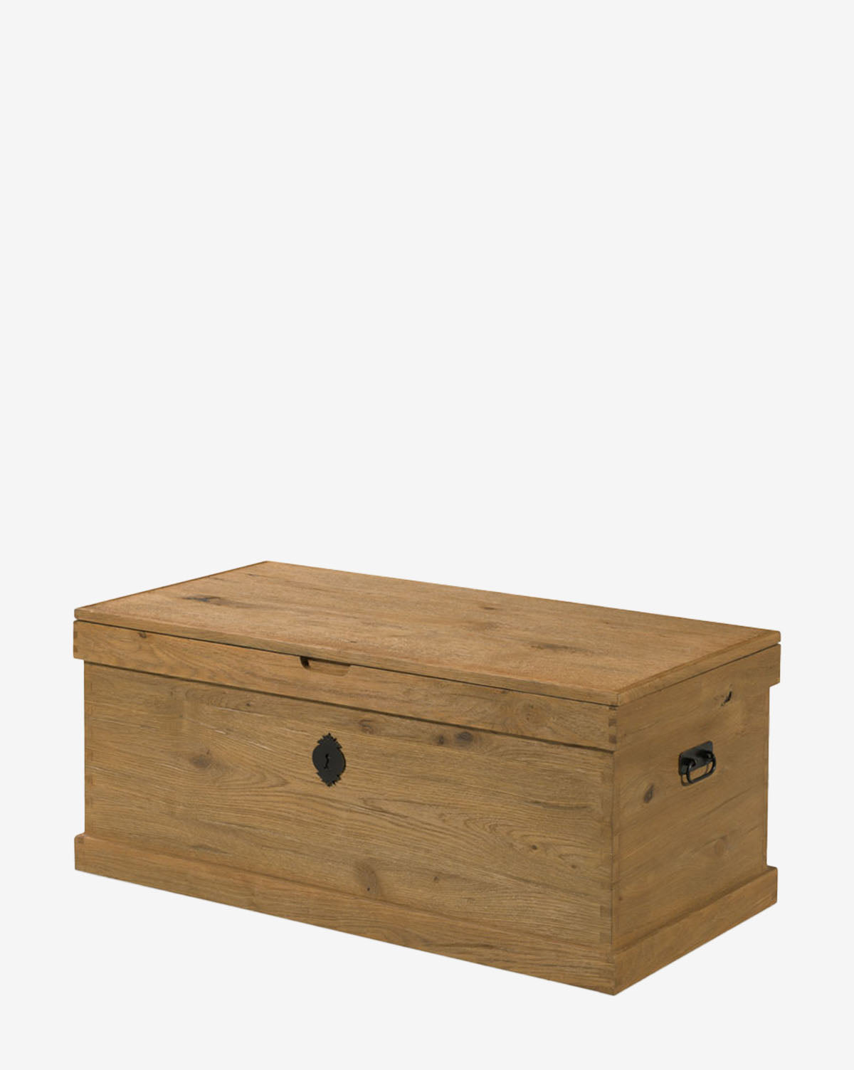 The Frances Trunk is a rectangular wooden storage piece with a natural oak veneer, hinged lid, metal side handles, and front keyhole, providing ample storage space against a plain white background by Vendixs