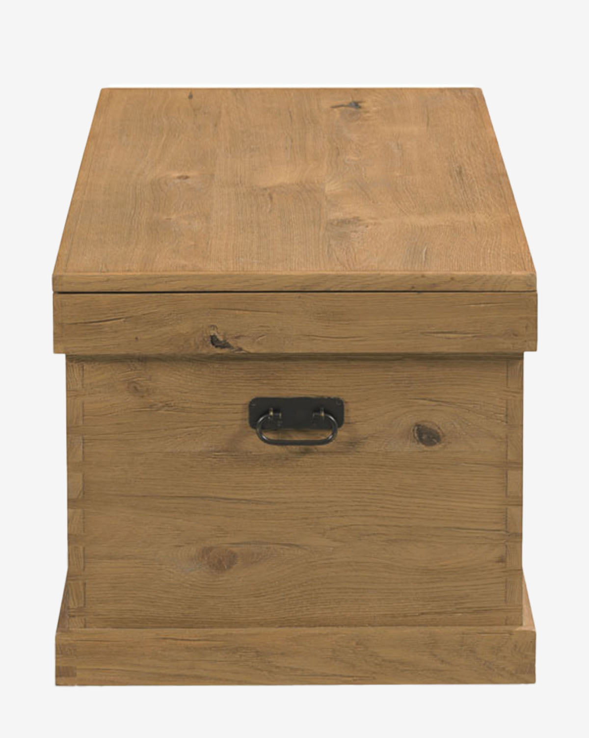 The Frances Trunk is a rectangular storage chest with a natural oak veneer, dovetail joints, hinged lid, and a black metal front handle, shown against a plain white background, by Vendixs