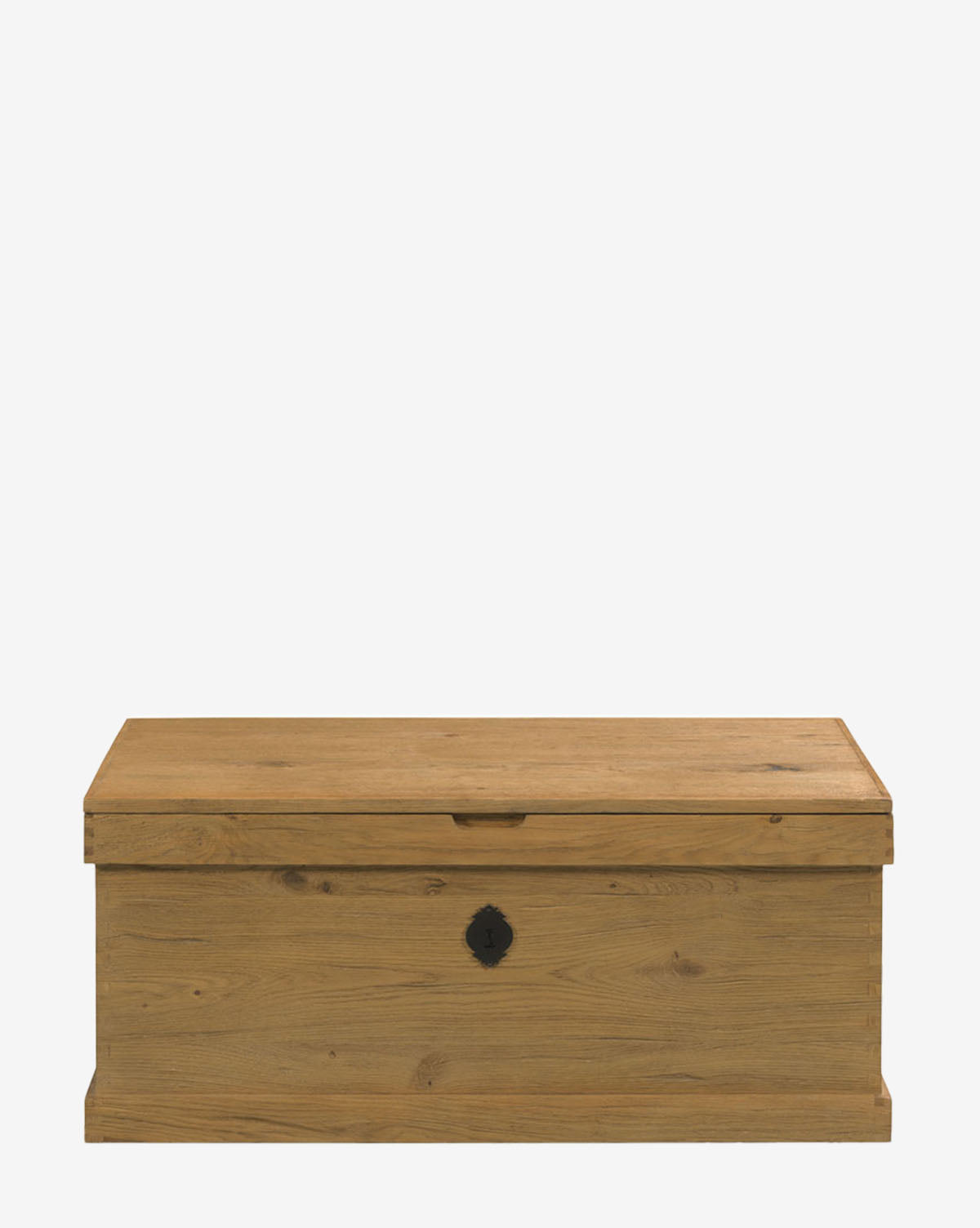The Frances Trunk, featuring a rectangular shape, flat lid, natural oak veneer, and small black metal lock plate on the front, provides generous storage space and is shown on a plain white background by Vendixs