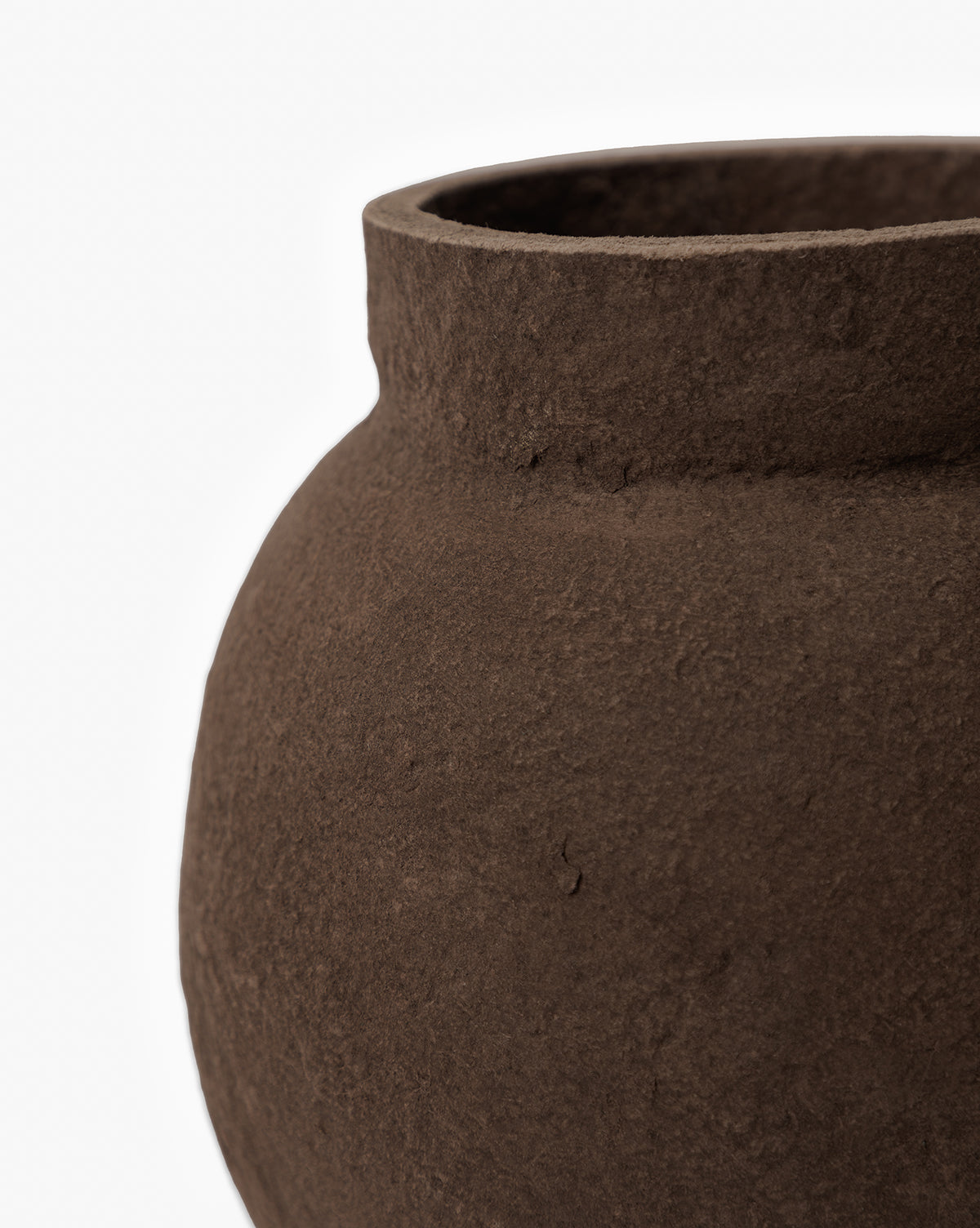 Close-up of the Frederick Paper Mache Vase, featuring a textured dark brown surface and wide opening. Only the upper part and one side of this handmade vase are visible, set against a white background, by Vendixs