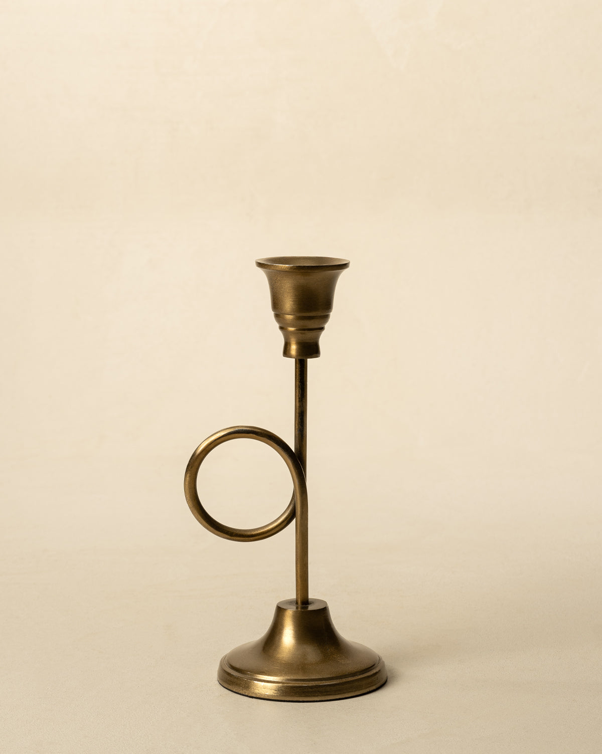A beautiful french horn shaped candle holder, perfect for holiday decor from McGee & Co.