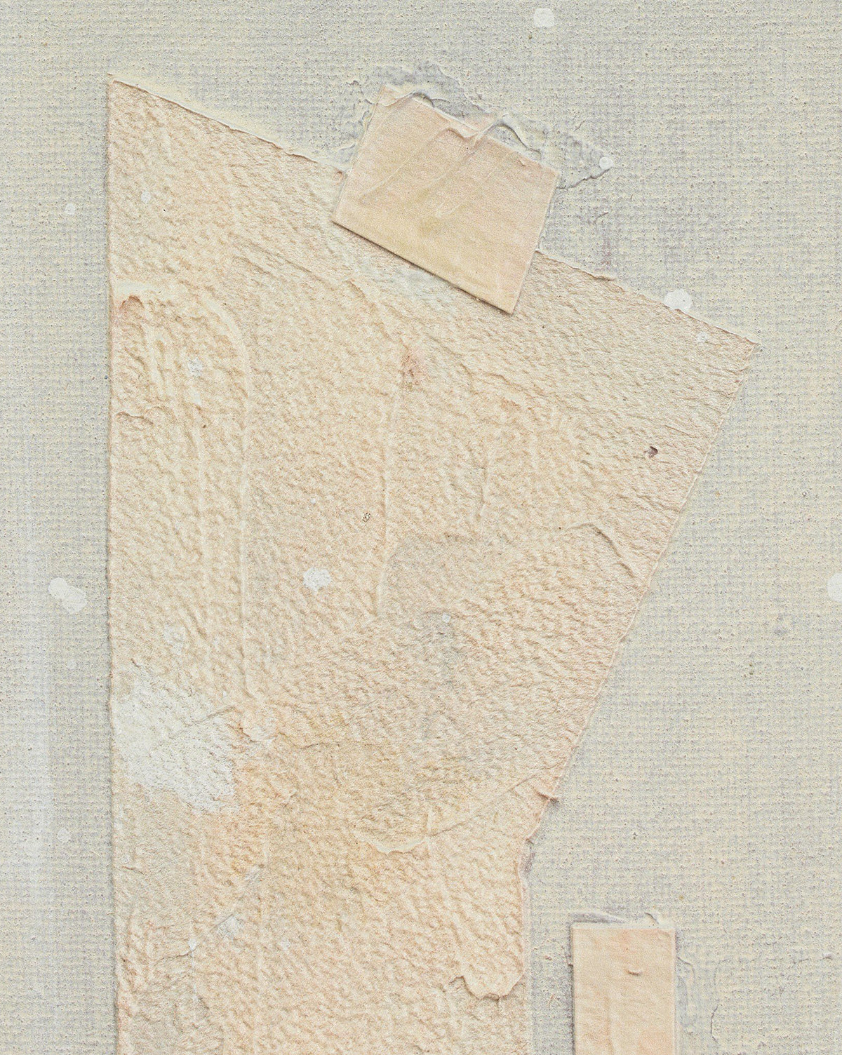 A textured piece of off-white paper is taped to a light gray canvas with beige tape. Featuring torn edges and subtle stains, Galactic IX by Jade Dacay offers unique minimalist wall decor with mixed media art details, by McGee & Co.