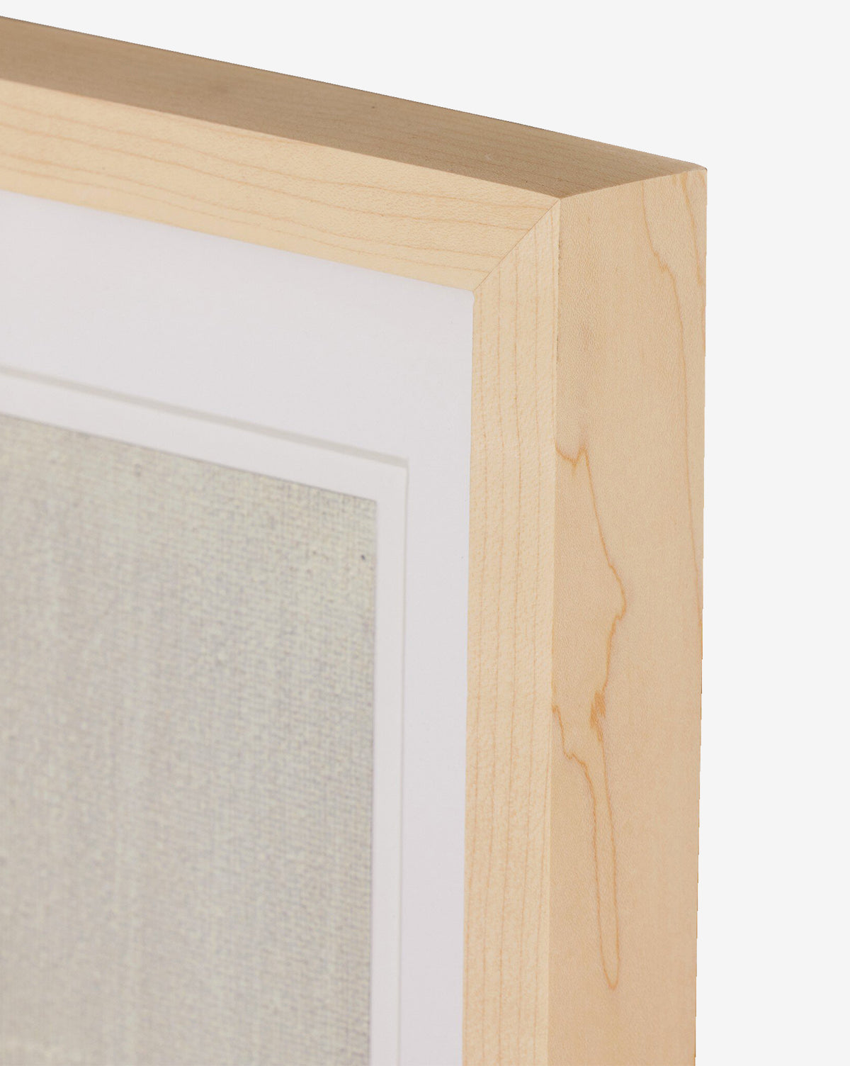 Close-up of a natural-toned frame with a white mat, showcasing Galactic VI by Jade Dacay, a textured, pale mixed media minimalist artwork set against a plain white background, by Vendixs