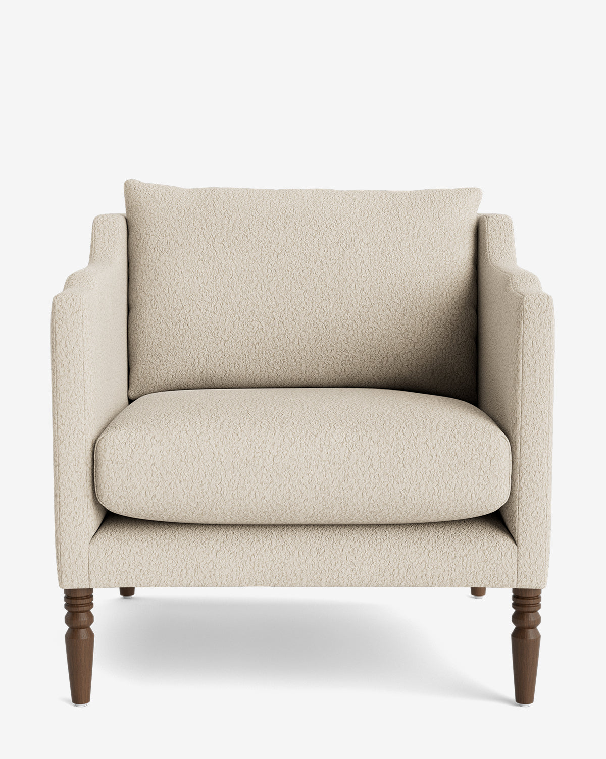 A front view of the Gemma Lounge Chair, a modern beige armchair featuring high-quality fabric upholstery, plush seat and back cushions, and traditional turned legs set against a plain white background by McGee & Co.