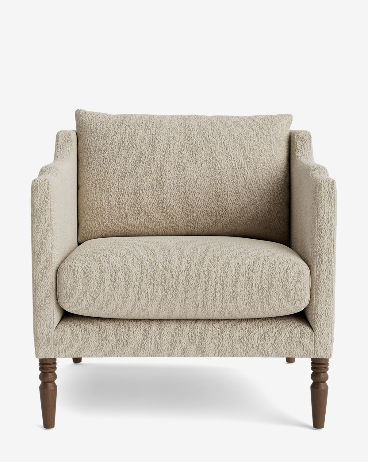 Front view of the Gemma Lounge Chair featuring textured beige high-quality fabric, plush seat and back cushions, and four classic turned legs, set against a plain white background, by Vendixs