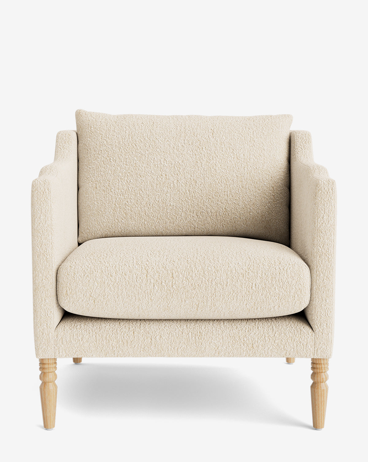 The Gemma Lounge Chair showcases plush cream fabric, square arms, a deep seat cushion, and four light wooden legs, by McGee & Co. Its displayed from the front against a plain white background.