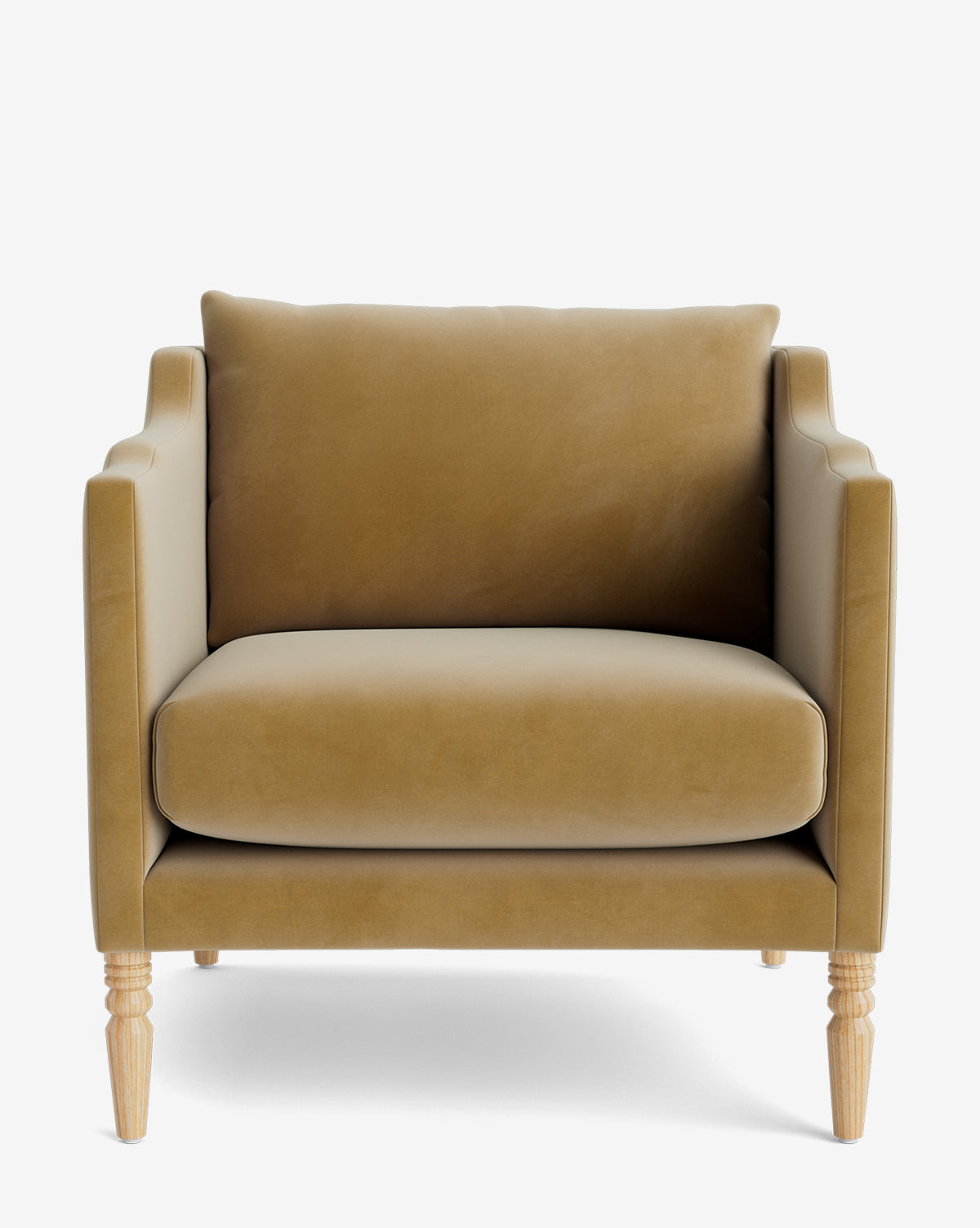 The Gemma Lounge Chair is a mustard-yellow velvet armchair with high-quality fabric, traditional turned wooden legs, a boxy silhouette, wide seat cushion, and large back cushion, shown from the front against a white background by McGee & Co.