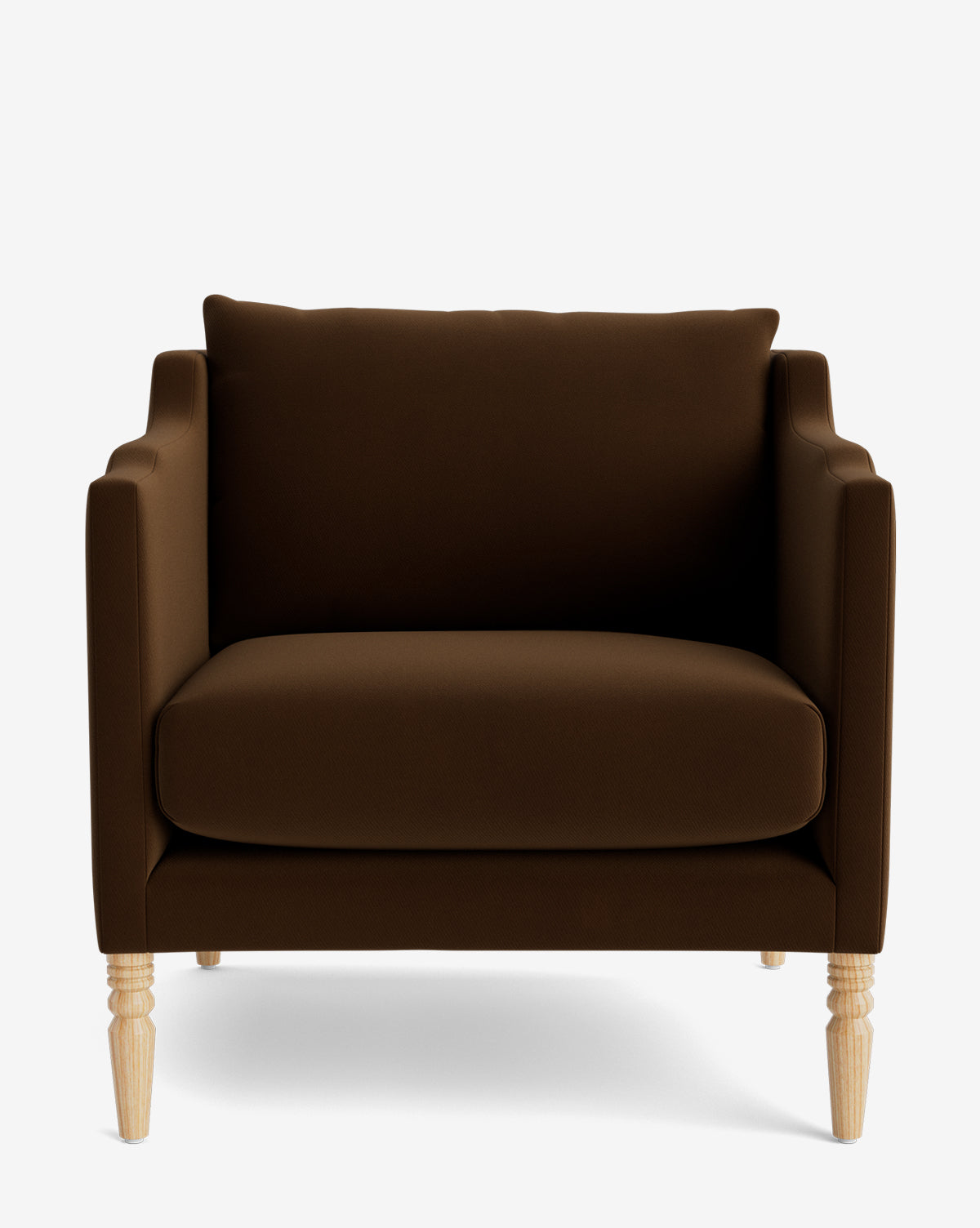 The Gemma Lounge Chair is a brown upholstered seat with a boxy shape, plush seat and back cushions, high-quality fabric, and four light wooden legs, displayed against a plain white background by McGee & Co.