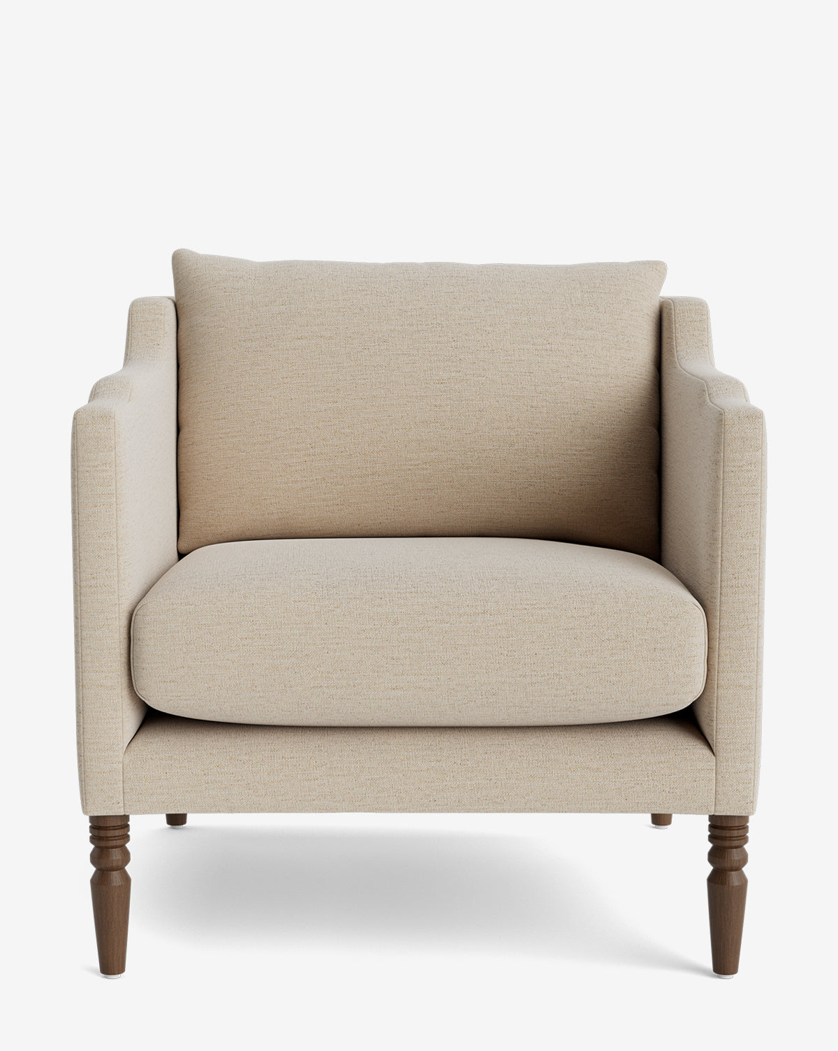 The Gemma Lounge Chair is a beige upholstered armchair with traditional turned legs, shown from the front, featuring a thick seat cushion and a matching cushioned backrest against a white background by McGee & Co.
