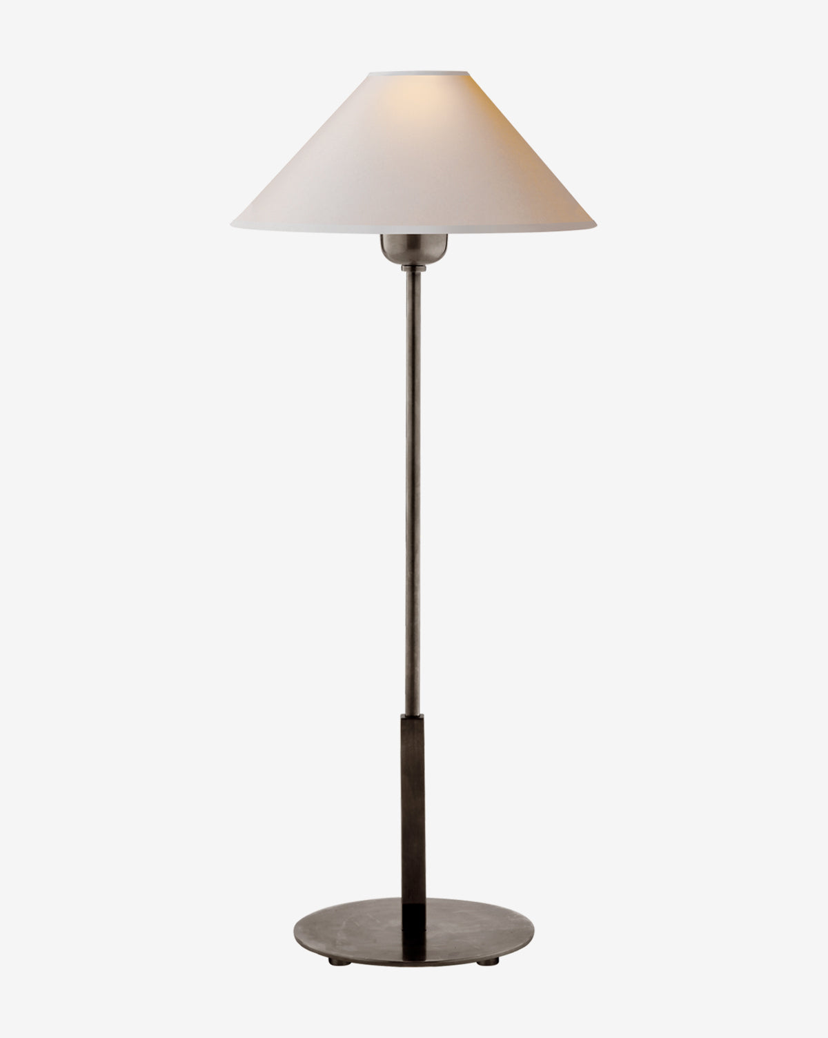 The Hackney Table Lamp by Visual Comfort & Co. Signature features a slim dark brass body, a wide white linen shade, and a minimalist, elegant design that softly glows against a plain white background. Vendixs