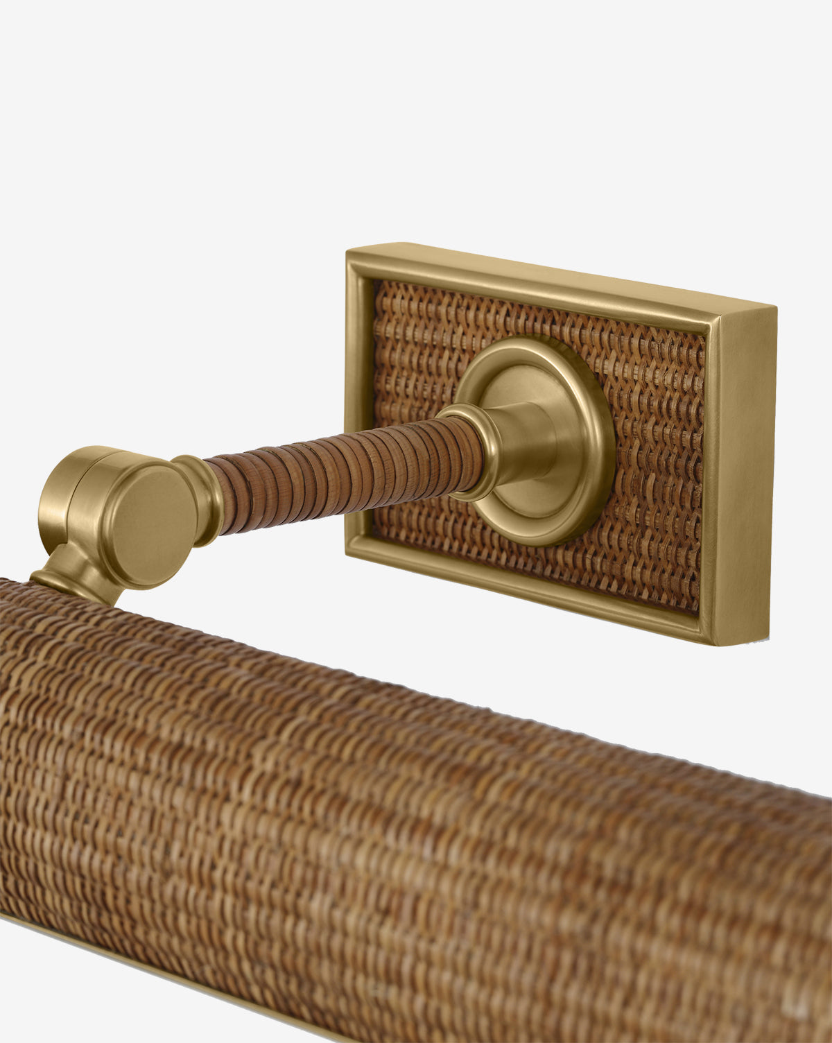A close-up of the Halwell Picture Light, featuring a brushed brass mount and woven rattan accents on the bar and wall plate, set against a plain white background, by Vendixs
