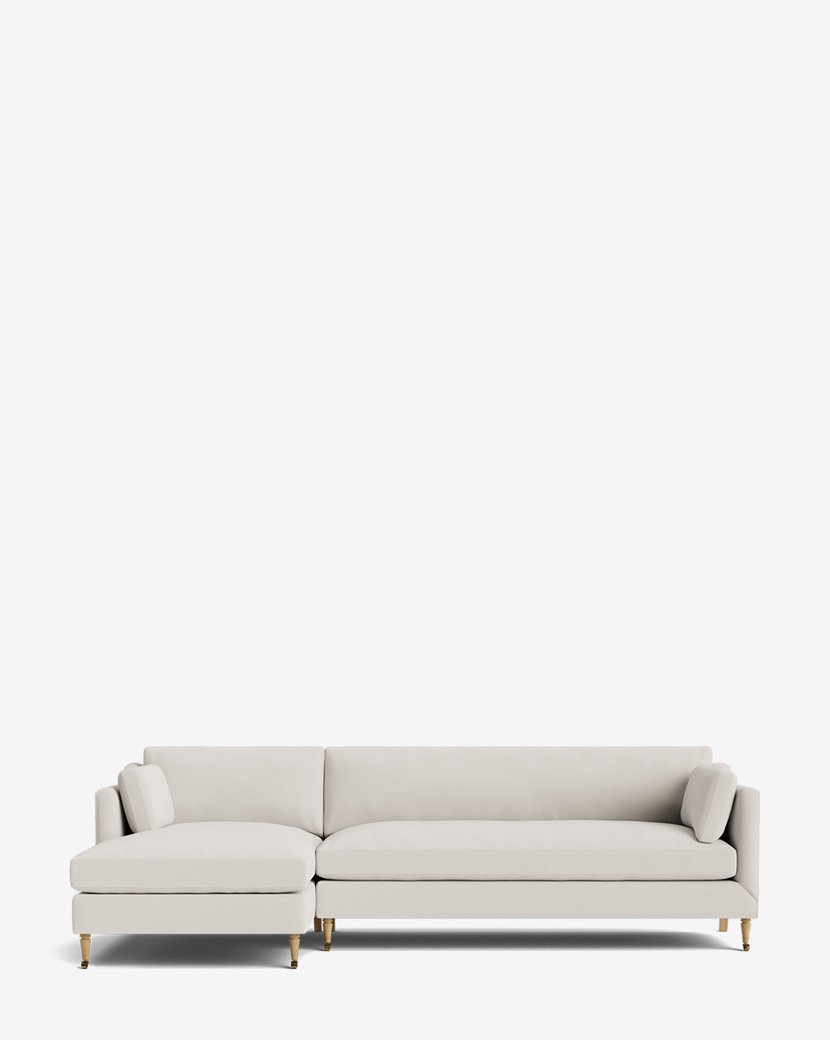 The Rowe Fine Furniture Haverford Upholstered Left Chaise Sectional in light gray features gold-tipped legs and two cylindrical pillows, shown against a plain white background, Vendixs