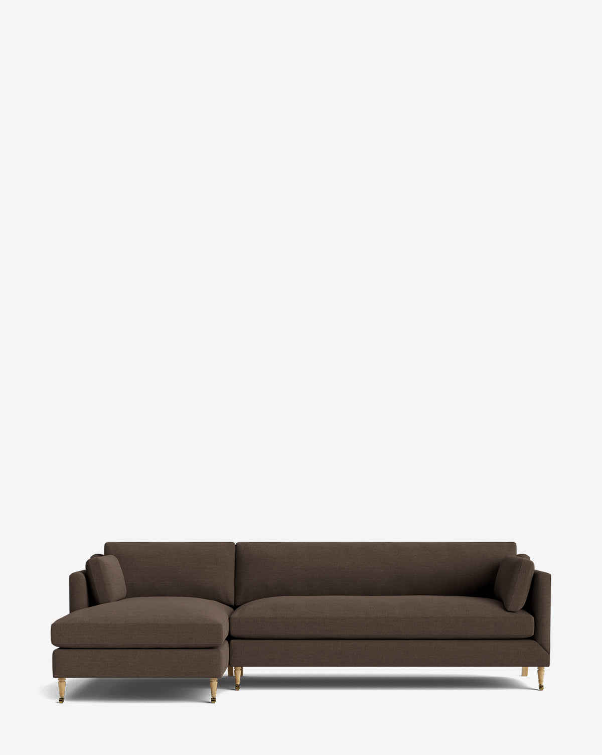 The Rowe Fine Furniture Haverford Upholstered Left Chaise Sectional in dark brown features gold-toned legs and two matching cylindrical cushions, blending comfort and style for contemporary spaces. Set against a plain white background. Vendixs