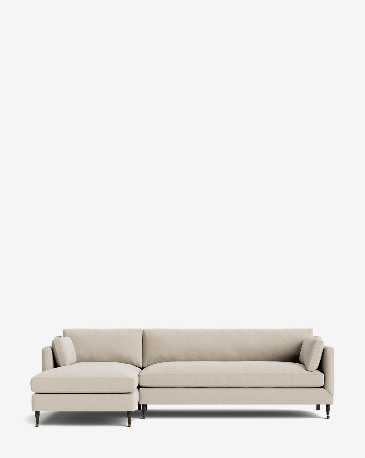 The Rowe Fine Furniture Haverford Upholstered Left Chaise Sectional features a modern light beige design, two bolster pillows, slim dark legs, and a customizable chaise—shown here against a plain white background. Vendixs