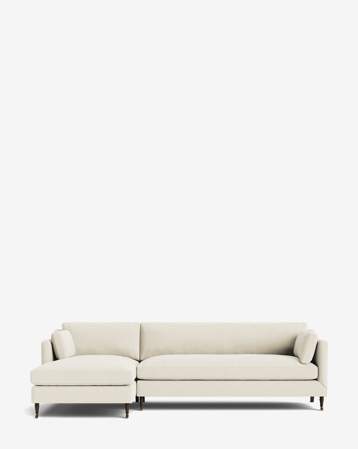 The Rowe Fine Furniture Haverford Upholstered Left Chaise Sectional features a modern, light beige design with slim armrests, two side cushions, and dark wooden legs—perfect for adding comfort and style to any space. Vendixs