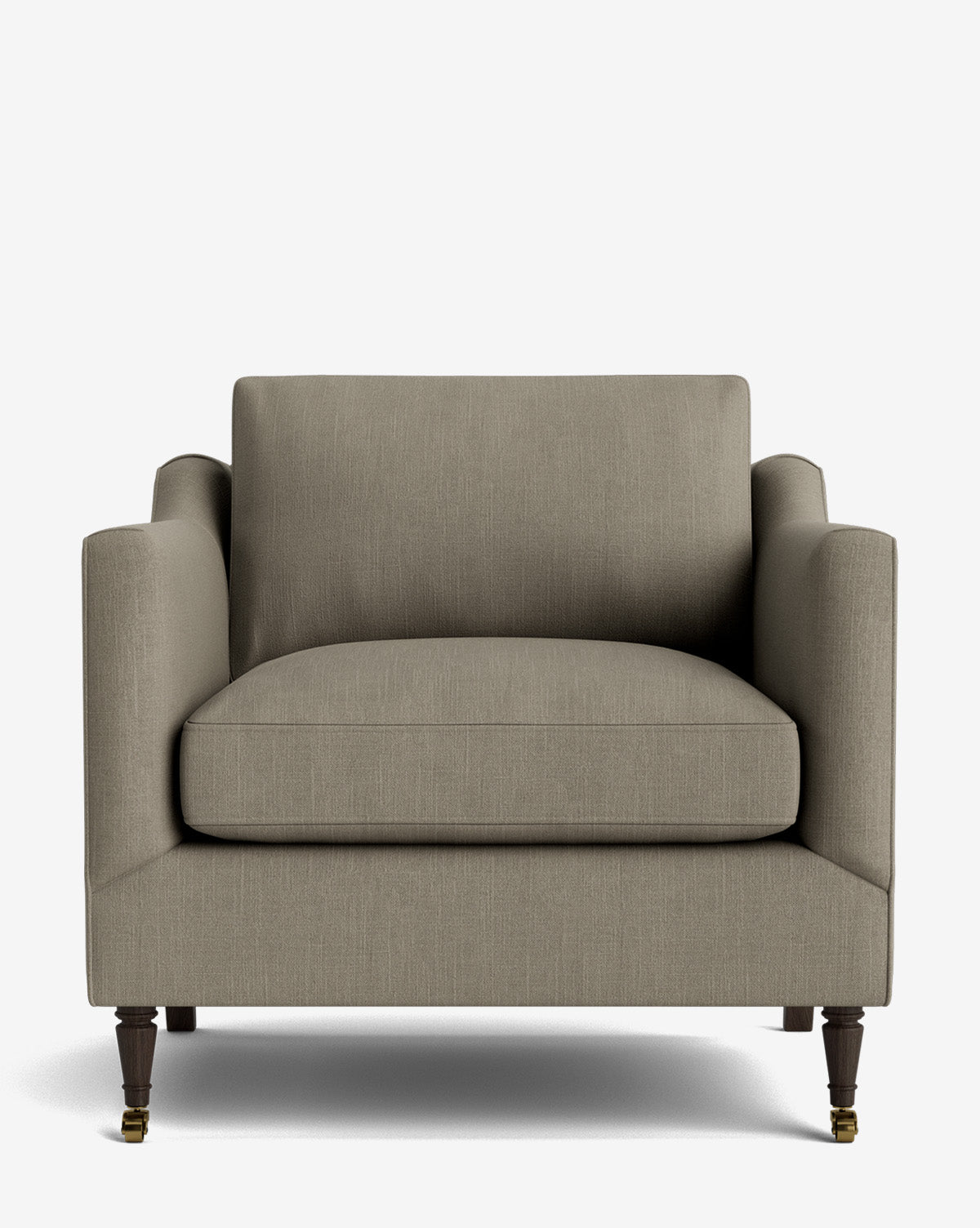 The Haverford Upholstered Lounge Chair features gray upholstery, a wide seat, square backrest, straight arms, and dark wooden legs with front brass casters, by McGee & Co. This handcrafted chair is shown against a white background.