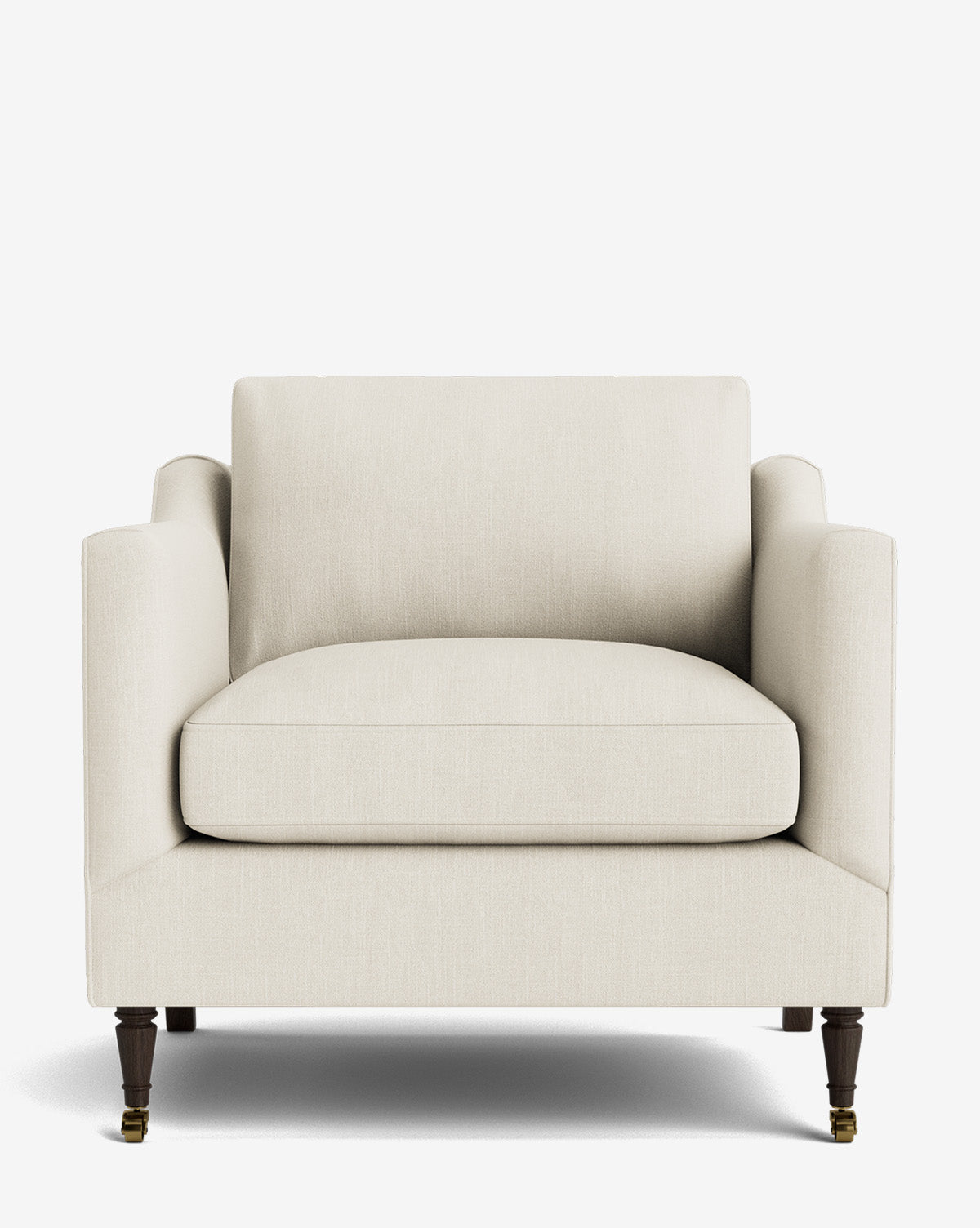 The Haverford Upholstered Lounge Chair features a modern, cream finish with soft cushions, straight arms, boxy shape, and dark wooden legs on brass wheels, shown against a plain white background by McGee & Co.
