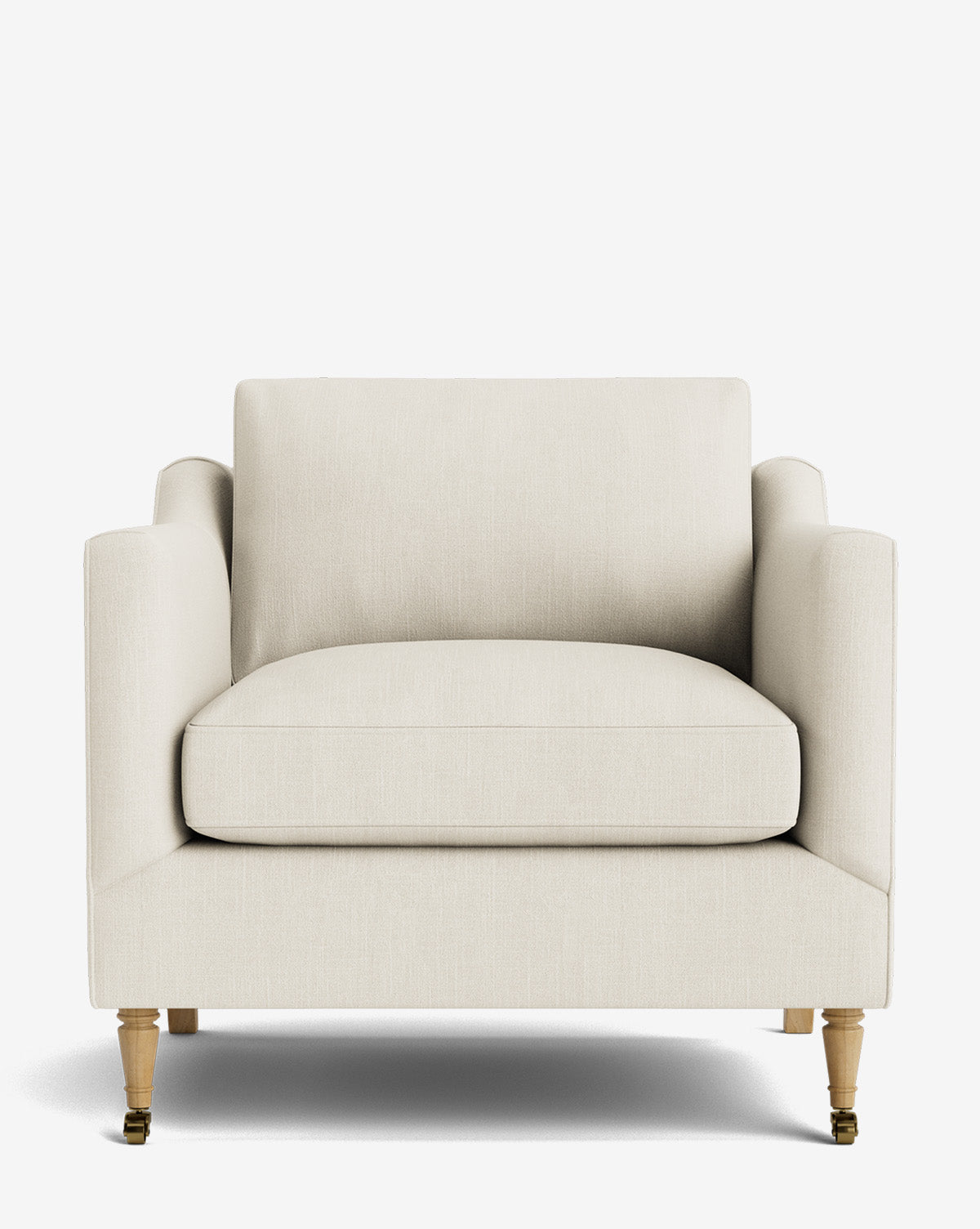 A front view of the Haverford Upholstered Lounge Chair, featuring a modern cream-colored design with cushioned seat and backrest, straight arms, wooden legs, and two small brass casters on the front legs, by Vendixs