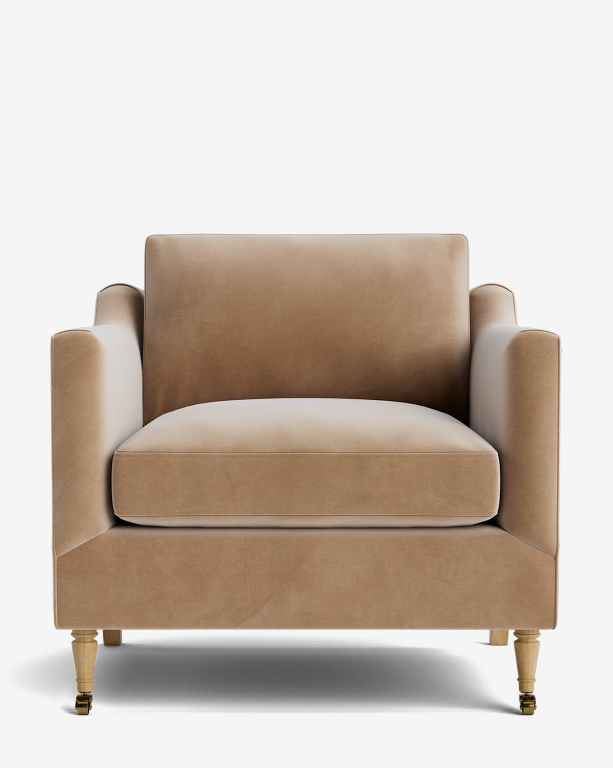 The Haverford Upholstered Lounge Chair features tan velvet upholstery, square arms, a plush seat cushion, and wooden legs with brass casters on the front two, displayed against a plain white background by McGee & Co.