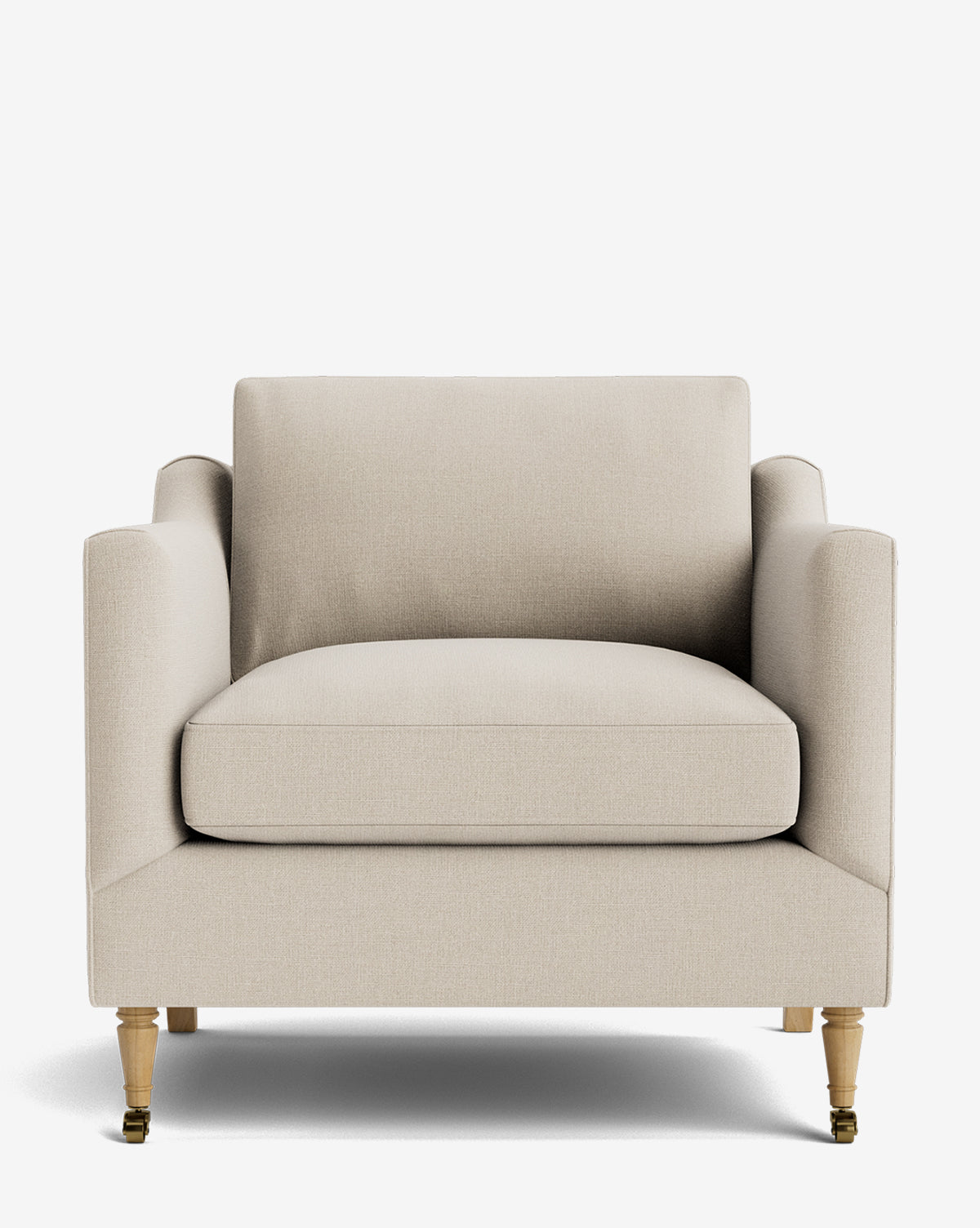 The Haverford Upholstered Lounge Chair features beige upholstery, straight arms, a plush seat cushion, and wooden legs—two with brass casters—delivering comfort and style against a plain white background by Vendixs
