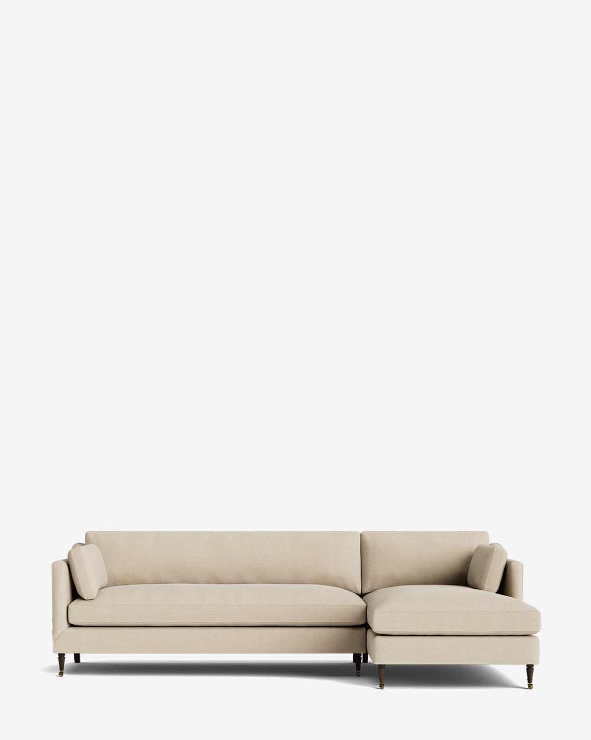 The Haverford Upholstered Right Chaise Sectional by Rowe Fine Furniture features light beige fabric, slim arms, wooden legs, and two cylindrical pillows in a right chaise design—shown against a plain white background. Vendixs