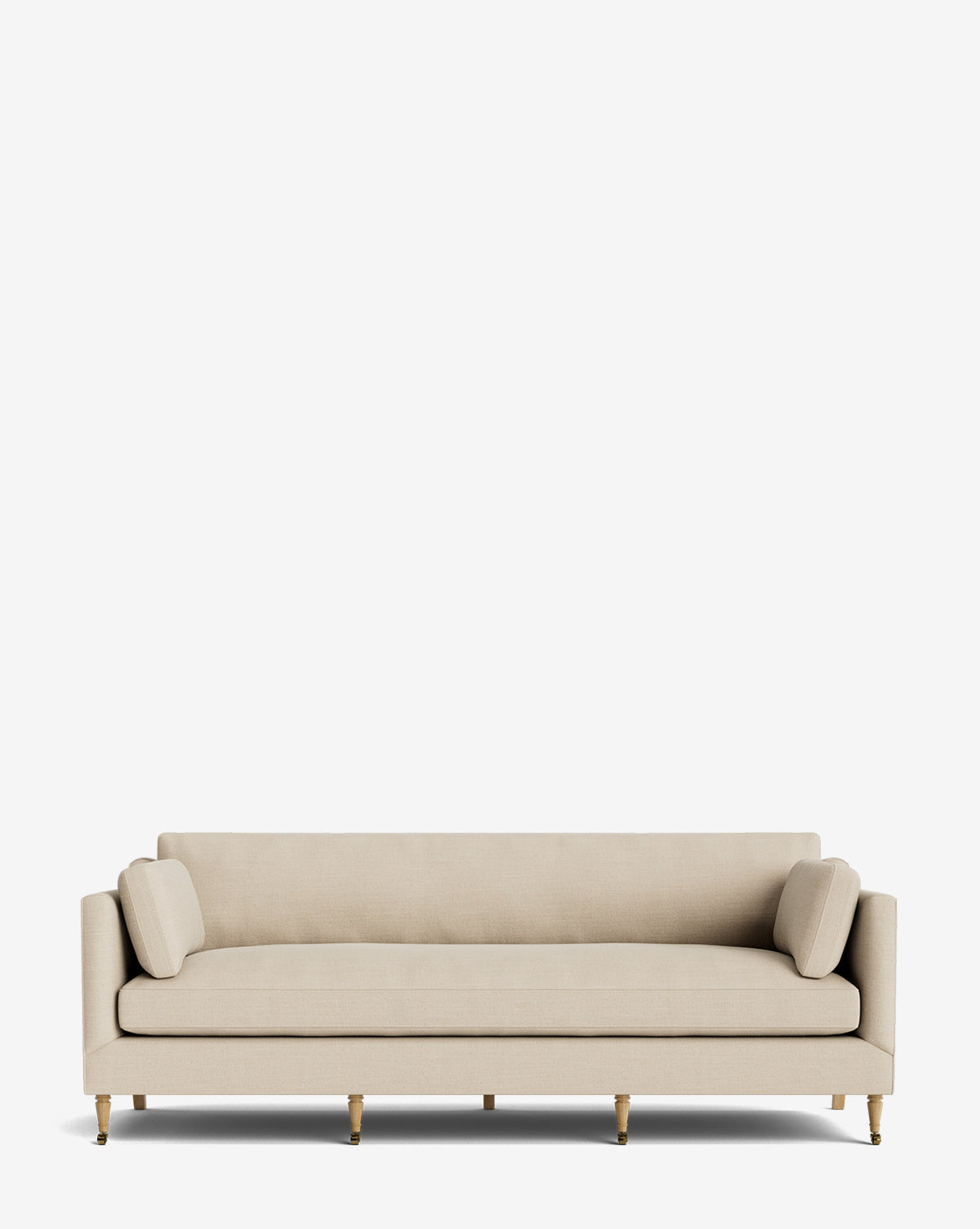 The Haverford Upholstered Sofa 90 is a modern, handcrafted beige sofa with straight lines, two cylindrical bolster pillows, and six wooden legs featuring gold accents, displayed against a plain white background by Vendixs