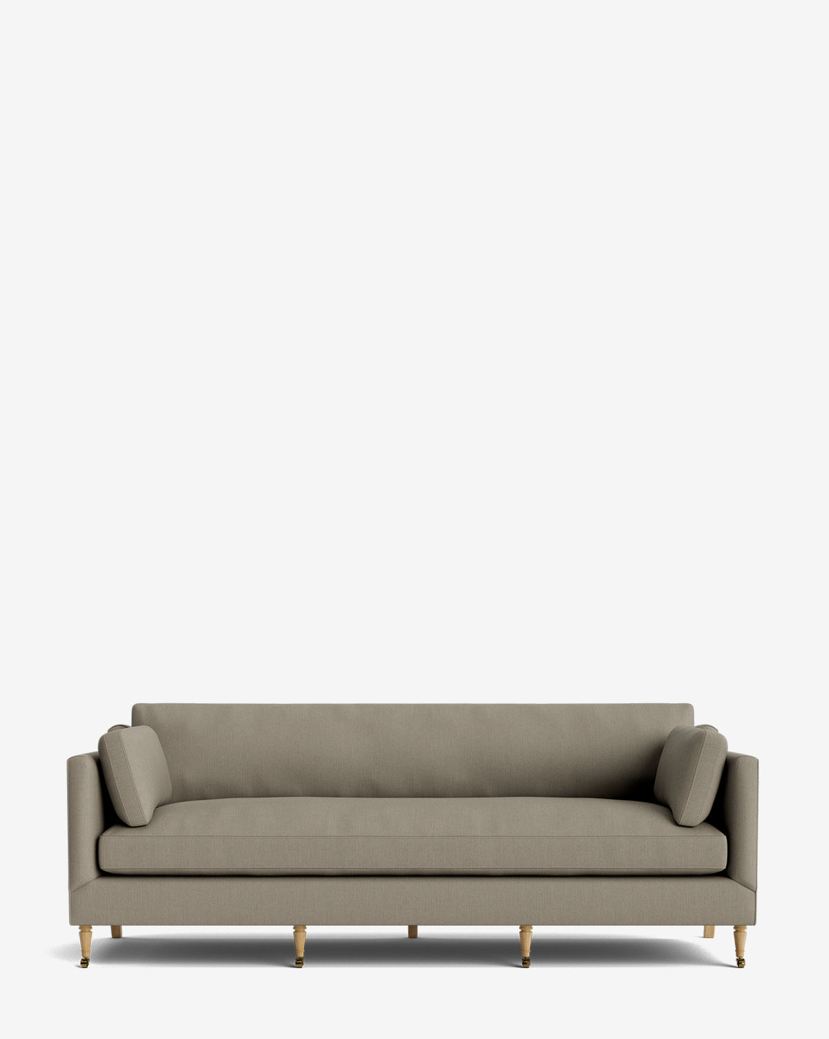 The Haverford Upholstered Sofa 90 is a modern, light grey handcrafted sofa with two cylindrical side cushions, straight armrests, and wooden legs with gold tips, shown on a plain white background by Vendixs