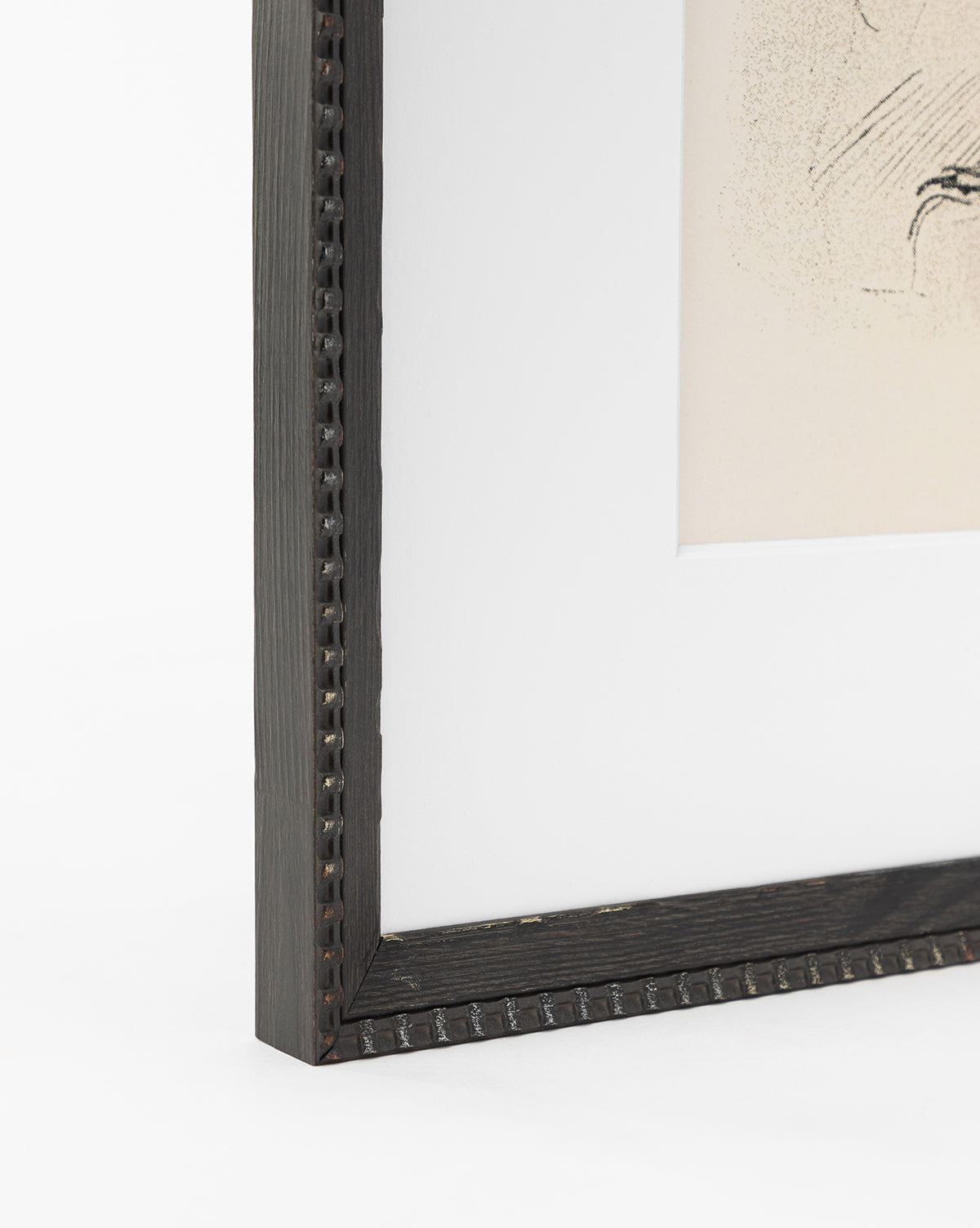 Close-up of the corner of a dark wooden frame with a beaded edge and white mat displaying Head Study. Perfect for showcasing sketched portraits or expressive linework. White background enhances the artworks detail, by Vendixs