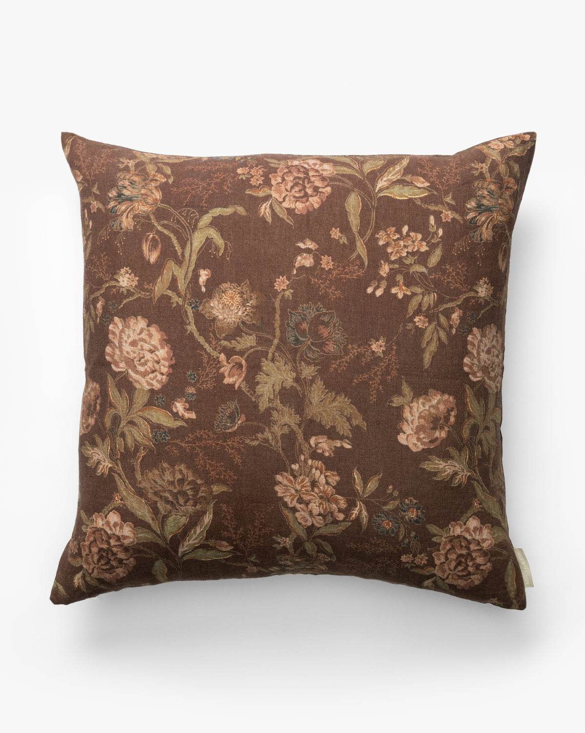 The Hestercombe Pillow Cover is a vintage-inspired square pillow cover with a brown background and floral patterns in muted pink, green, and beige, shown against a plain white backdrop by McGee & Co.