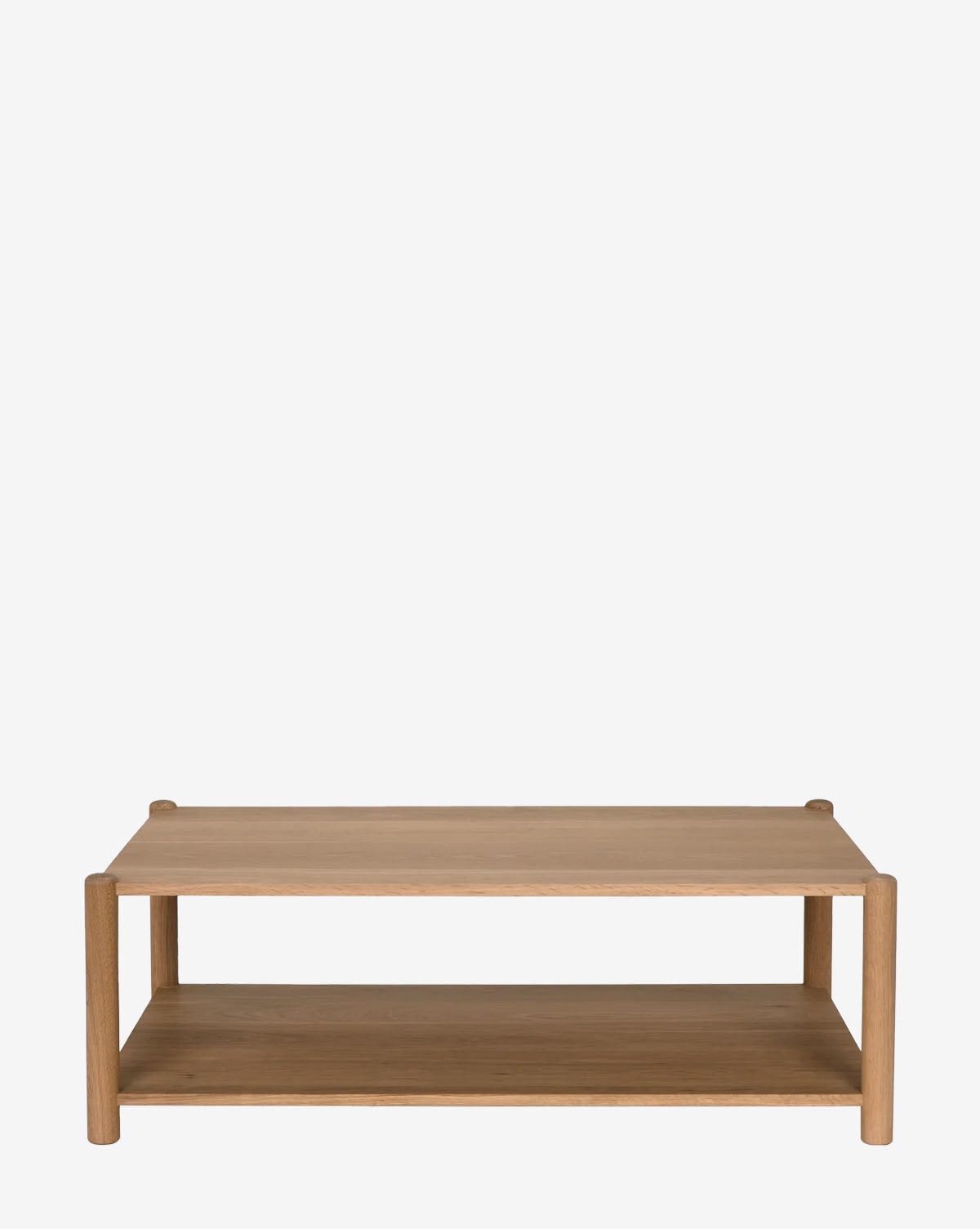 The Hetty Coffee Table showcases natural woodgrain in a rectangular design, featuring a lower shelf and rounded legs for a modern, minimalist look against a plain white backdrop, by McGee & Co.