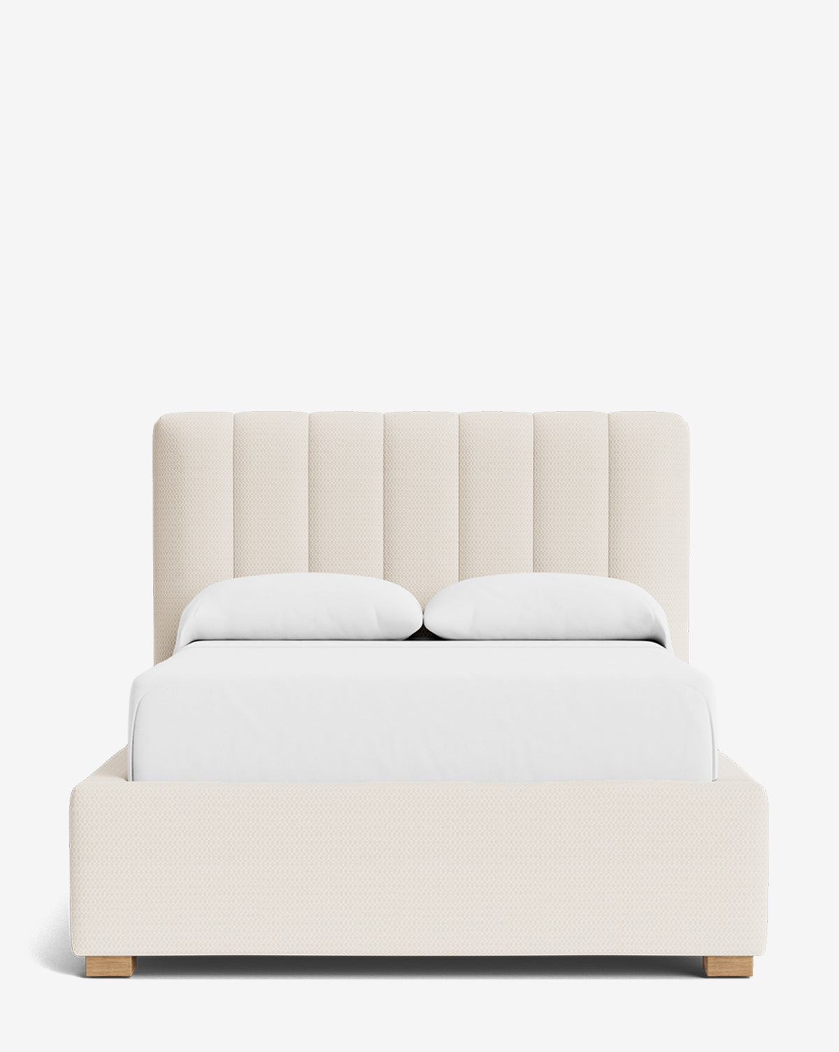 Front view of the Hoffman Bed Low Headboard, a modern upholstered bed with a customizable, cream-colored vertically paneled low headboard, two pillows, white blanket, and minimalist wooden block feet, by McGee & Co.