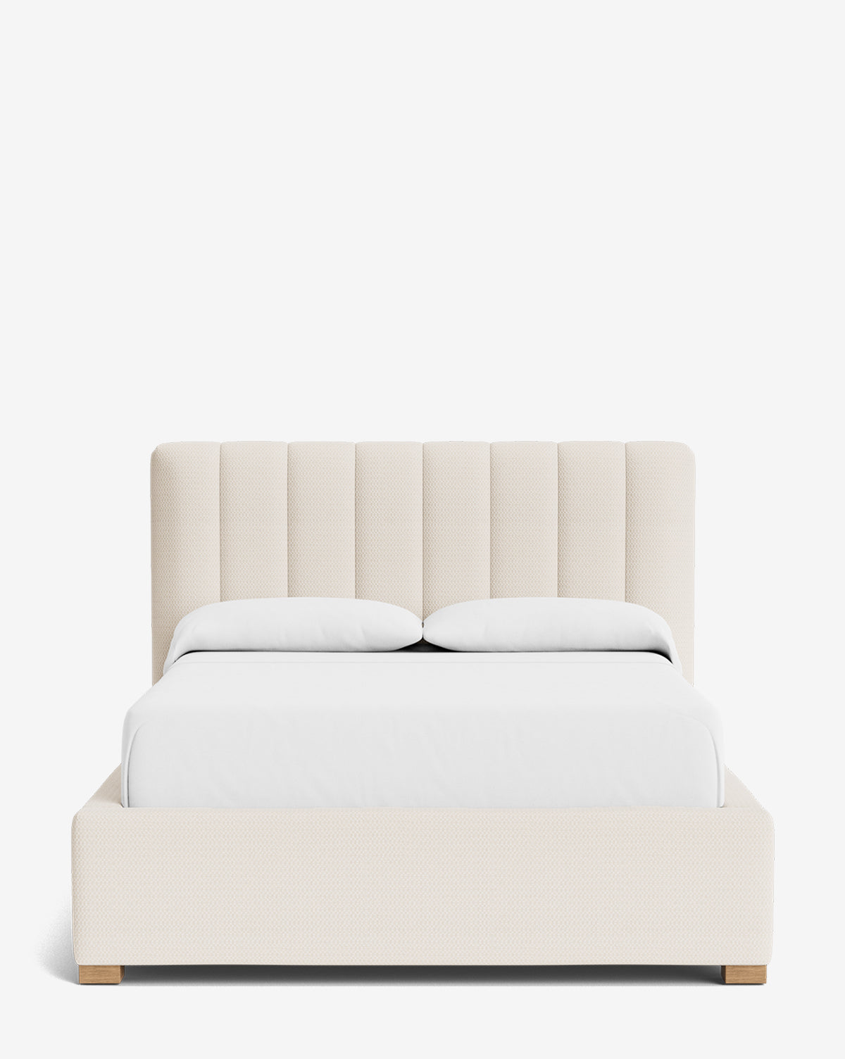 The Hoffman Bed Low Headboard in king size features a vertically upholstered beige headboard, customizable to your style, with white bedding and a matching low-profile beige frame with wooden feet, shown against a plain white background by Vendixs