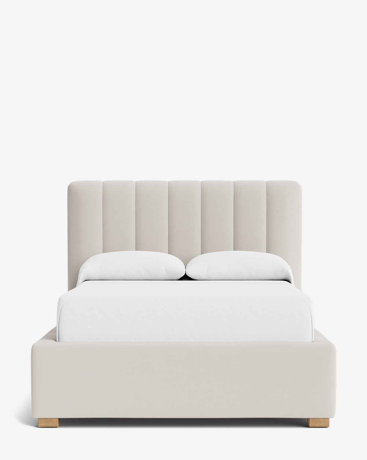 The Hoffman Bed Low Headboard is a modern upholstered bed with a padded, vertically channeled light beige customizable headboard, white bedding, and a low-profile frame with short wooden legs, shown on a plain white background by Vendixs