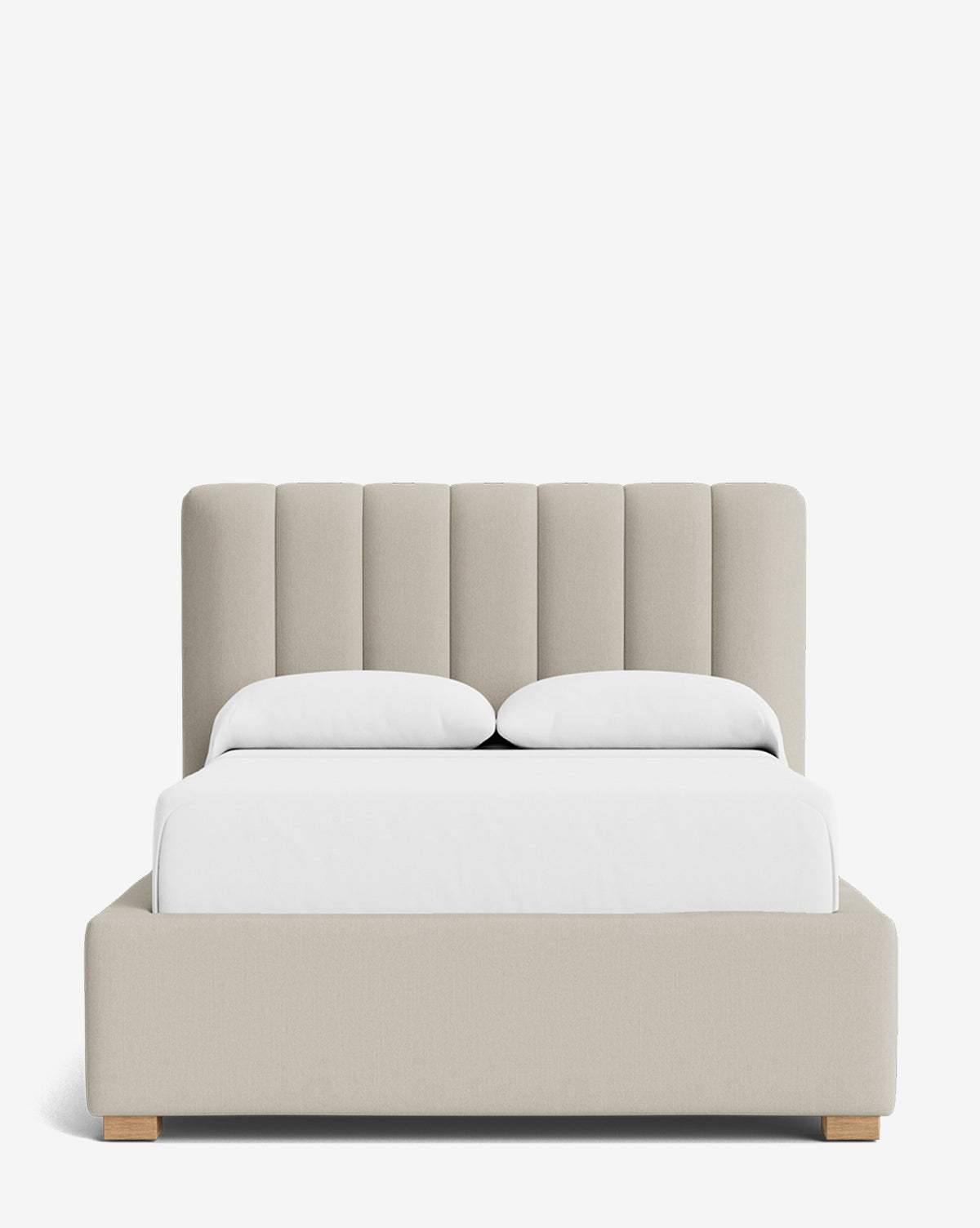 The Hoffman Bed Low Headboard is a modern beige upholstered bed with a customizable low headboard, white bedding, and light wooden legs, displayed against a plain white background by McGee & Co.