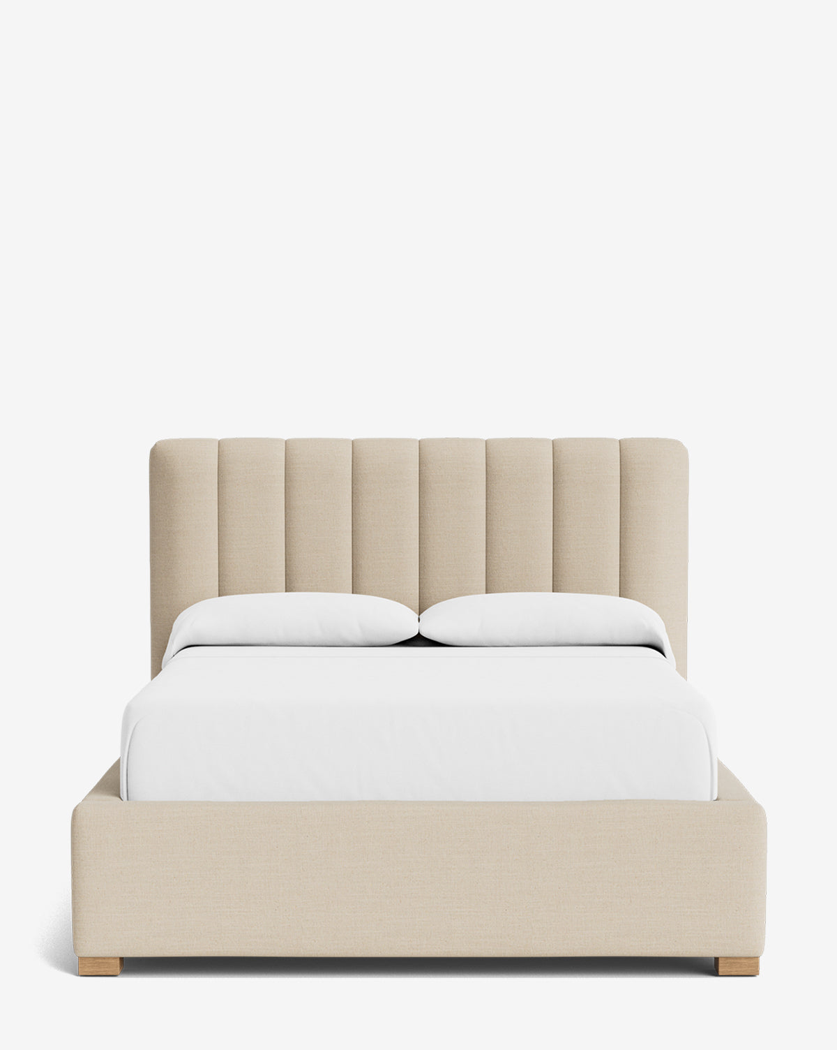 The Hoffman Bed Low Headboard is a beige upholstered bed with a customizable channeled low headboard, white bedding, and light wood legs, displayed against a plain white background by McGee & Co.