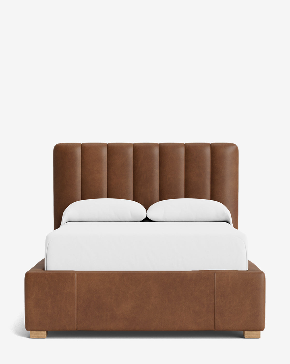The Hoffman Bed Low Headboard is a modern upholstered bed with a low-profile headboard, brown leather panels, and a matching frame, shown from the front with white bedding and pillows against a plain white background by McGee & Co.
