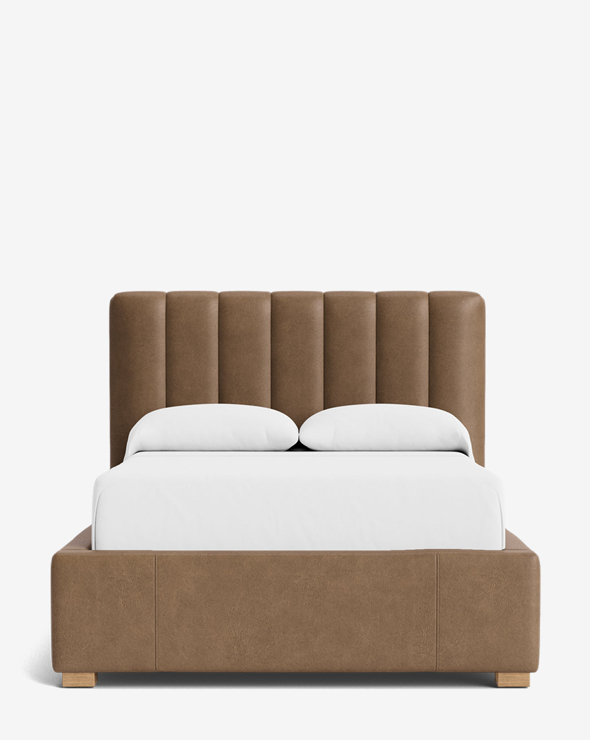 The Hoffman Bed Low Headboard is a customizable brown upholstered bed with a low headboard, white bedding, and wooden legs, displayed against a plain white background by McGee & Co.