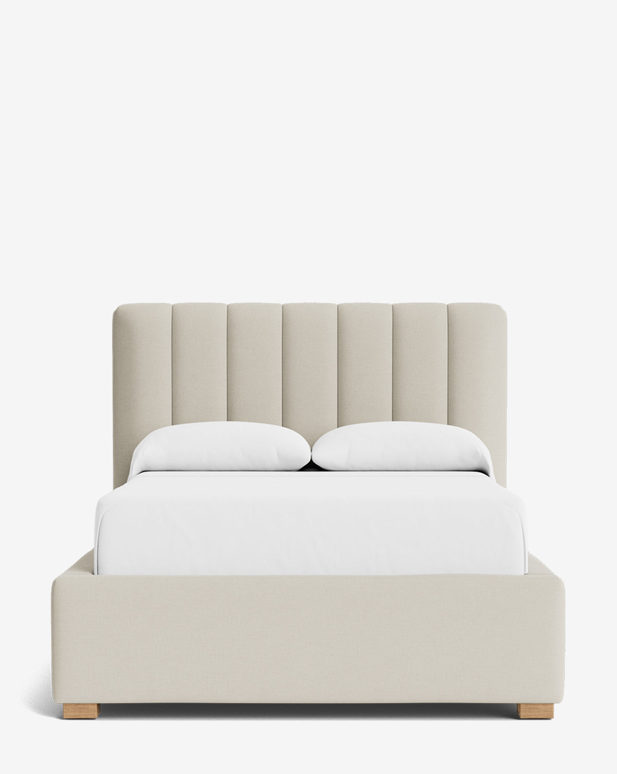 The Hoffman Bed Low Headboard is a modern beige upholstered bed with a customizable, vertically paneled low headboard, paired with two white pillows and white bedding, displayed on a plain white background by McGee & Co.