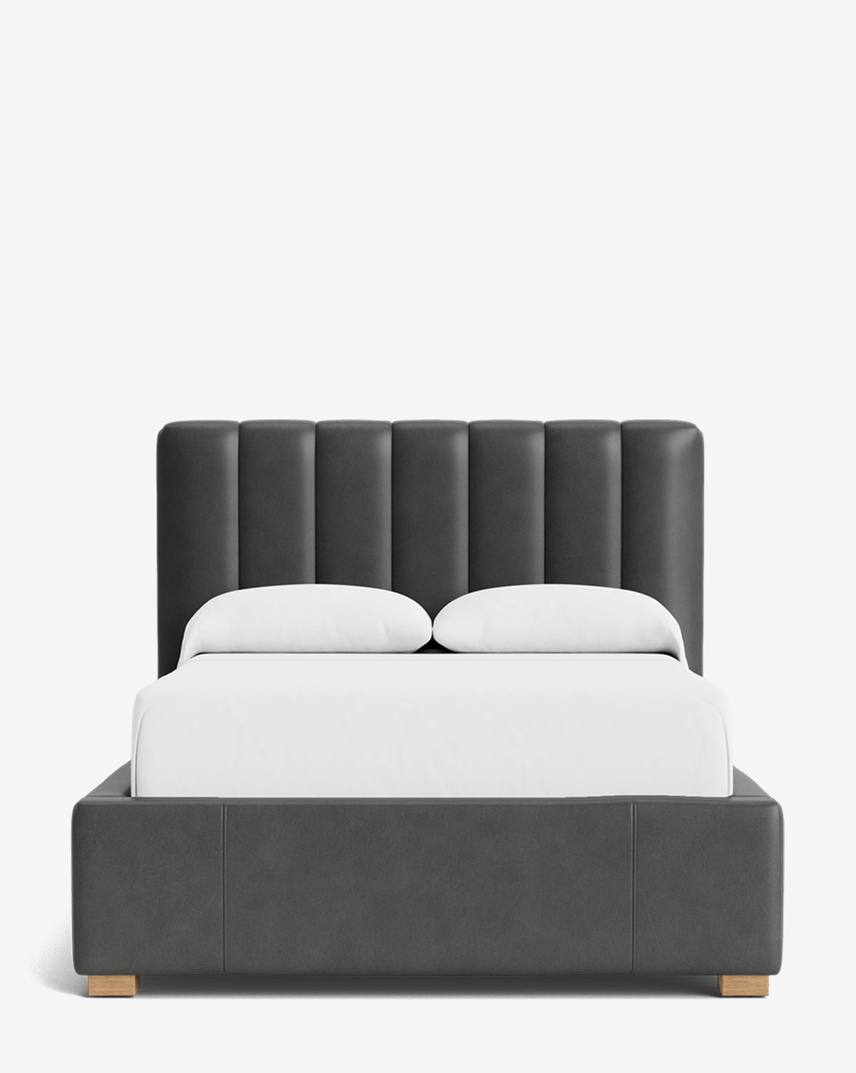 The Hoffman Bed Low Headboard is a modern, dark gray upholstered bed with vertical panel detailing and wooden legs, shown with white bedding and two white pillows against a plain white background by Vendixs