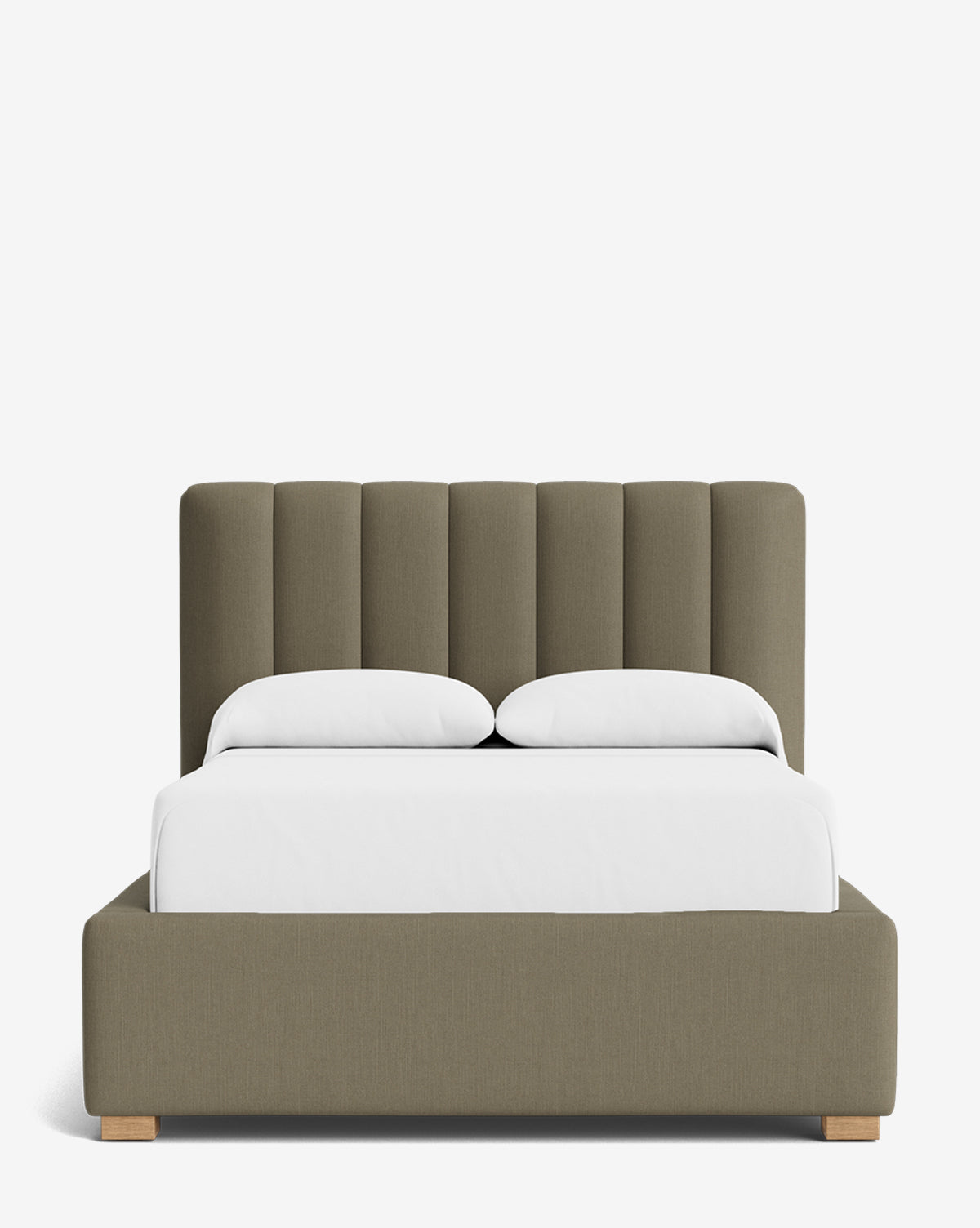 The Hoffman Bed Low Headboard is a modern upholstered bed in olive green with vertical panel detailing, white bedding and pillows, and small wooden block legs, set against a plain white background by McGee & Co.
