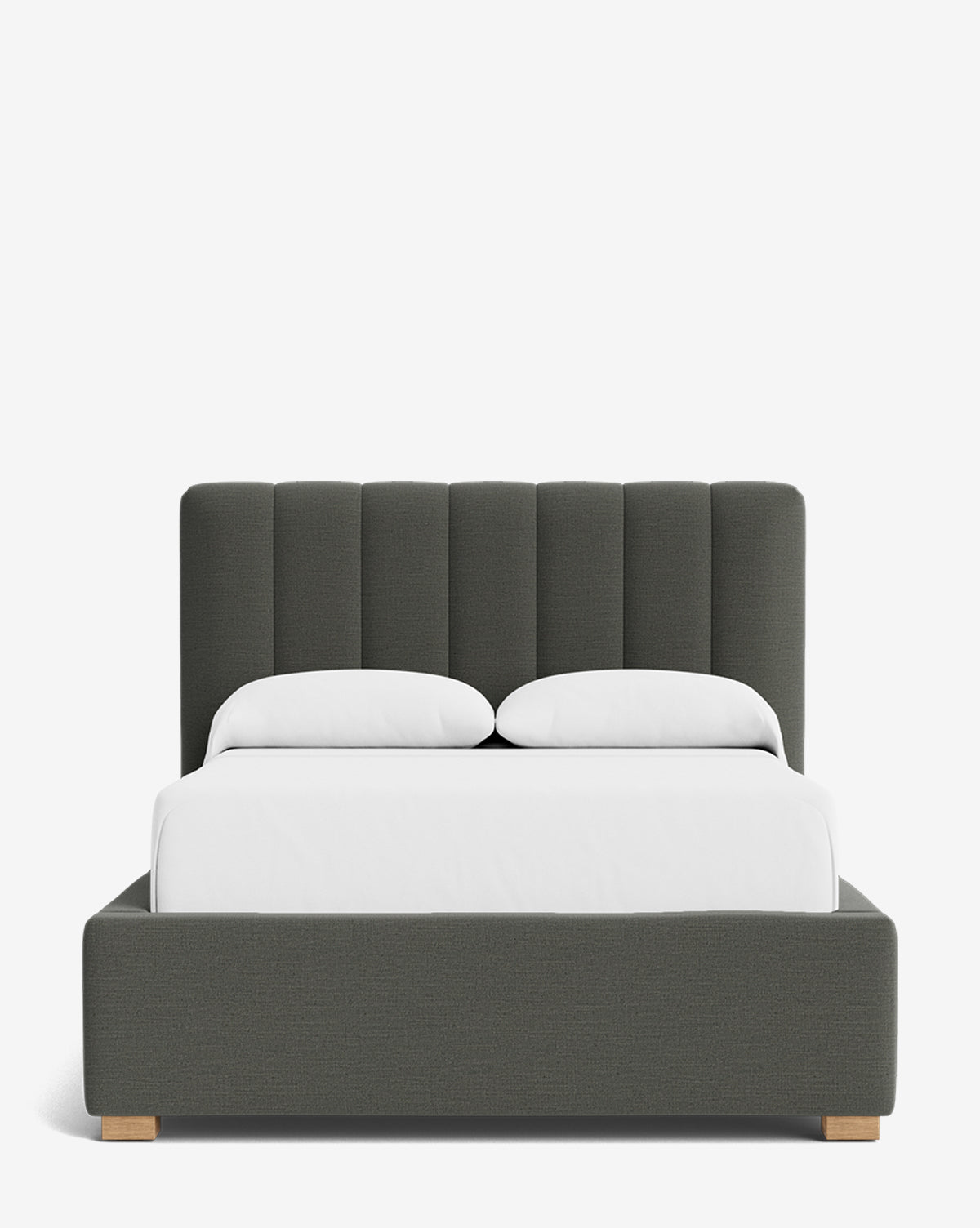 The Hoffman Bed Low Headboard is a modern upholstered bed with a customizable, dark gray vertical channel headboard, wooden legs, and crisp white bedding with two pillows, displayed against a plain white background, by McGee & Co.