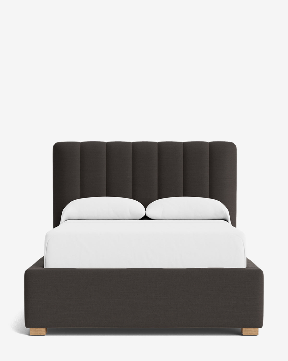 The Hoffman Bed Low Headboard features a modern dark upholstered frame, a customizable vertical tufted headboard, white bedding, and two pillows, all set against a plain white background by McGee & Co.