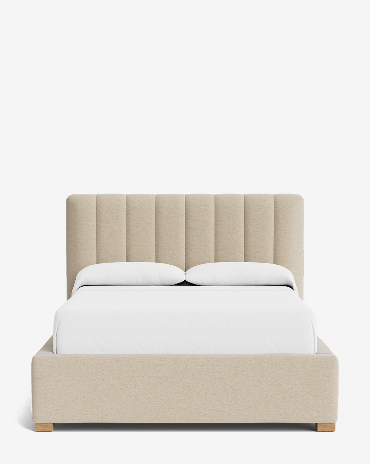 The Hoffman Bed Low Headboard features a beige upholstered frame with a tall, vertically channeled customizable headboard, shown with white bedding and two pillows against a plain white background, by McGee & Co.