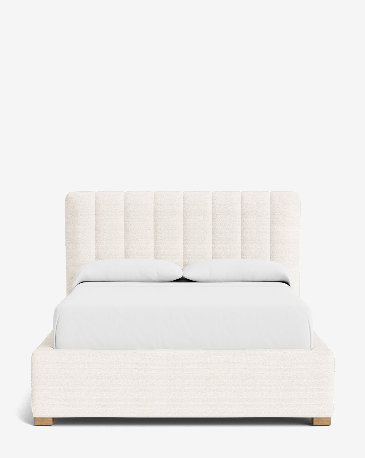 The Hoffman Bed Low Headboard is a modern upholstered bed with a customizable low headboard in light beige fabric, shown with white bedding and two pillows against a white background, by McGee & Co.