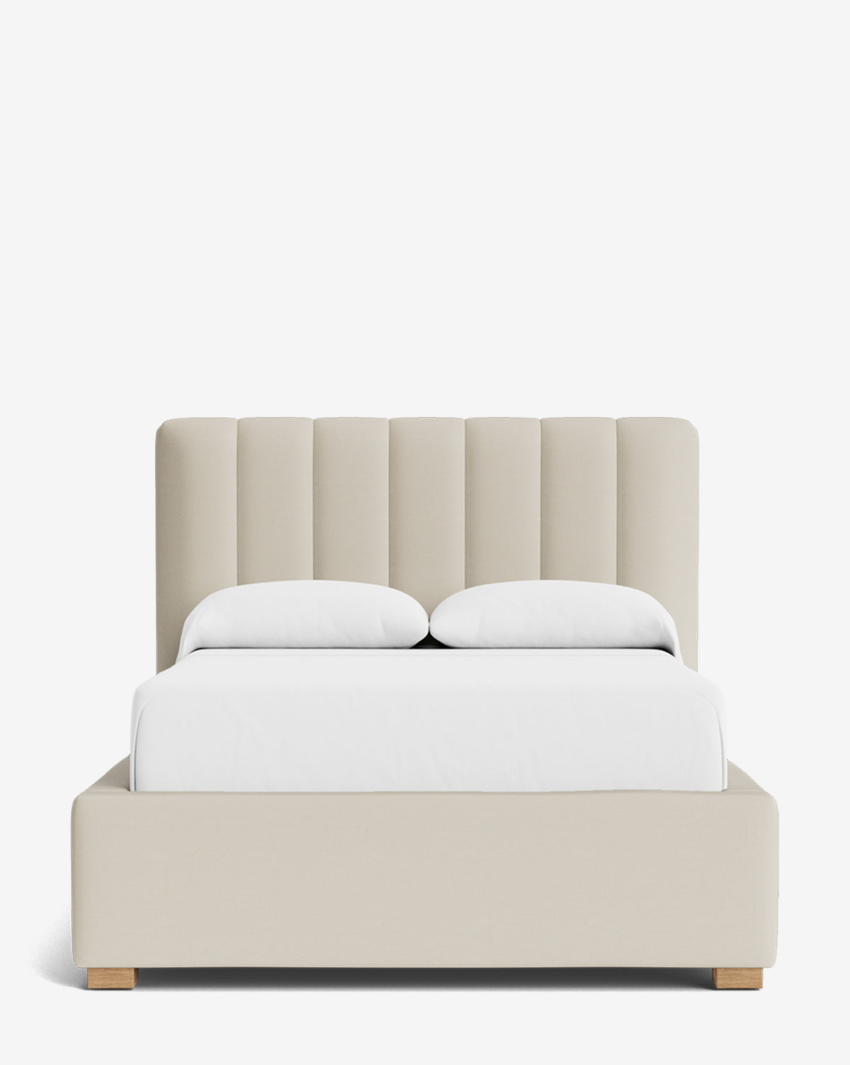 The Hoffman Bed Low Headboard is a modern beige upholstered bed with a low customizable headboard, vertical panels, white bedding, and two pillows, shown against a plain white background by McGee & Co.