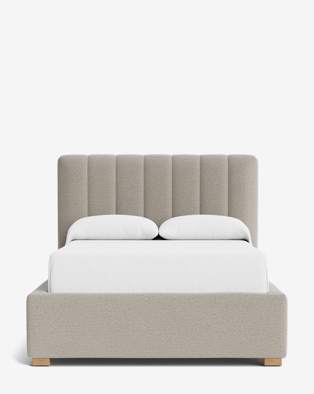 The Hoffman Bed Low Headboard is a modern upholstered bed with a low beige customizable headboard, two white pillows, white bedding, wooden legs, and a minimalist design set against a plain white background by McGee & Co.