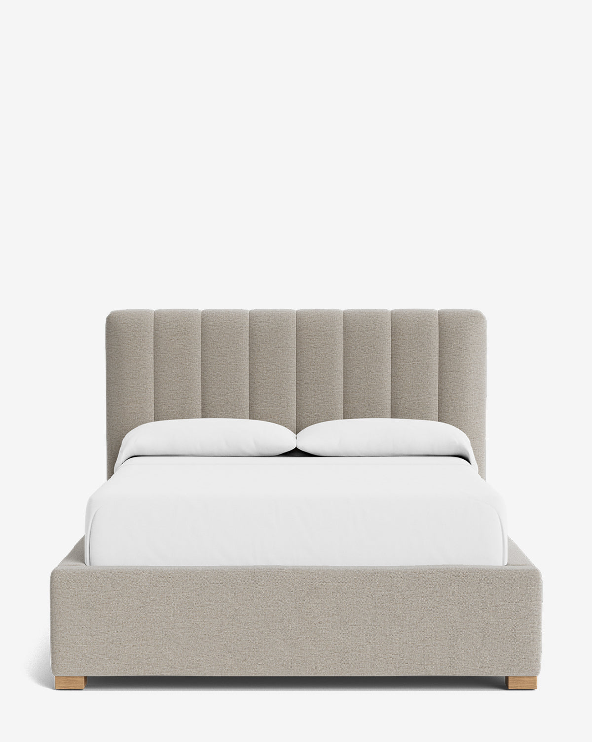 The Hoffman Bed Low Headboard features a customizable light gray upholstered headboard with vertical channels, wooden feet, and crisp white bedding—an elegant modern bed shown against a plain white background by McGee & Co.